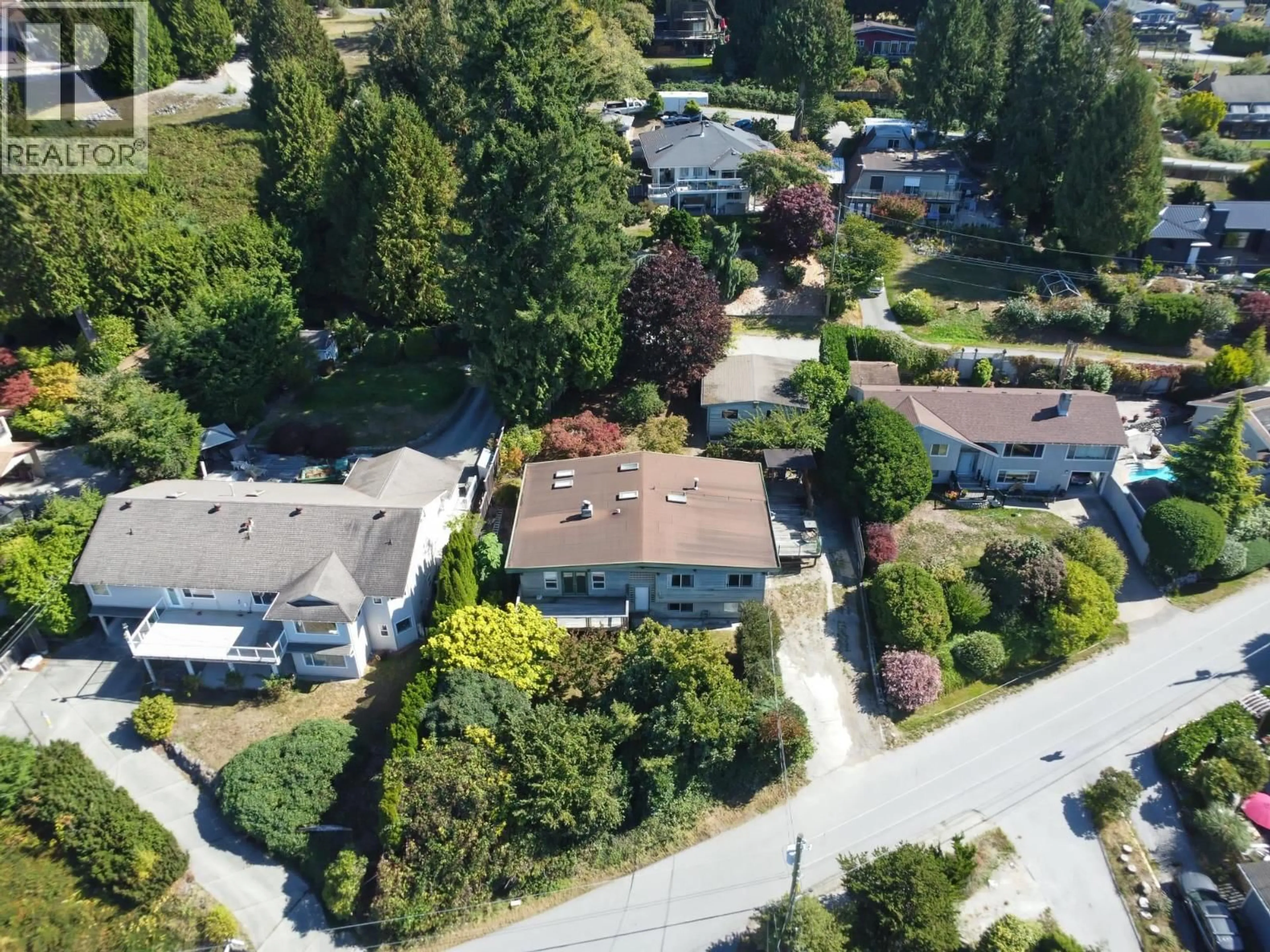 A pic from outside/outdoor area/front of a property/back of a property/a pic from drone, street for 5134 RADCLIFFE ROAD, Sechelt British Columbia V7Z0G5