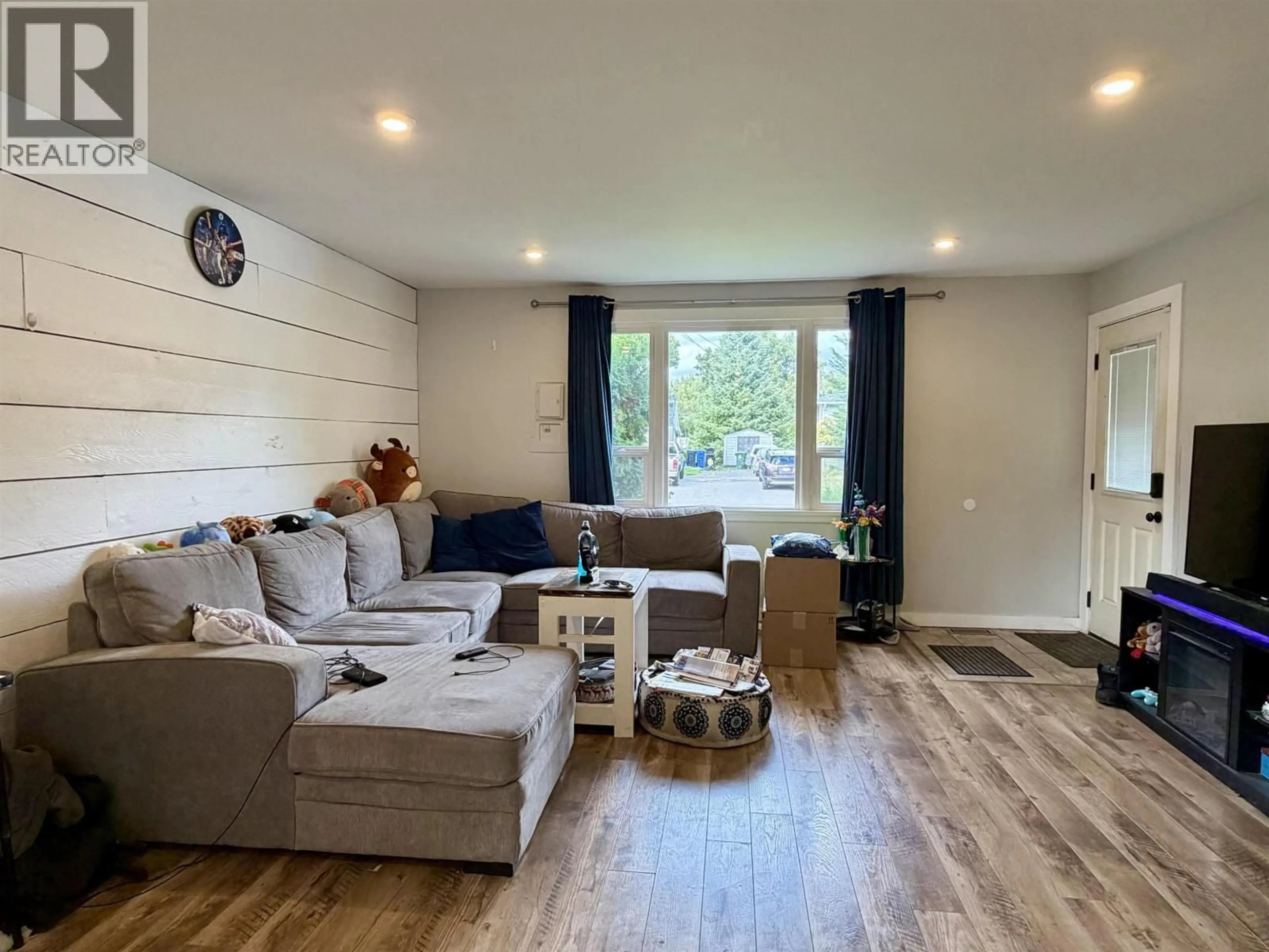 Living room with furniture, wood/laminate floor for 4735 SOUCIE AVENUE, Terrace British Columbia V8G2E9