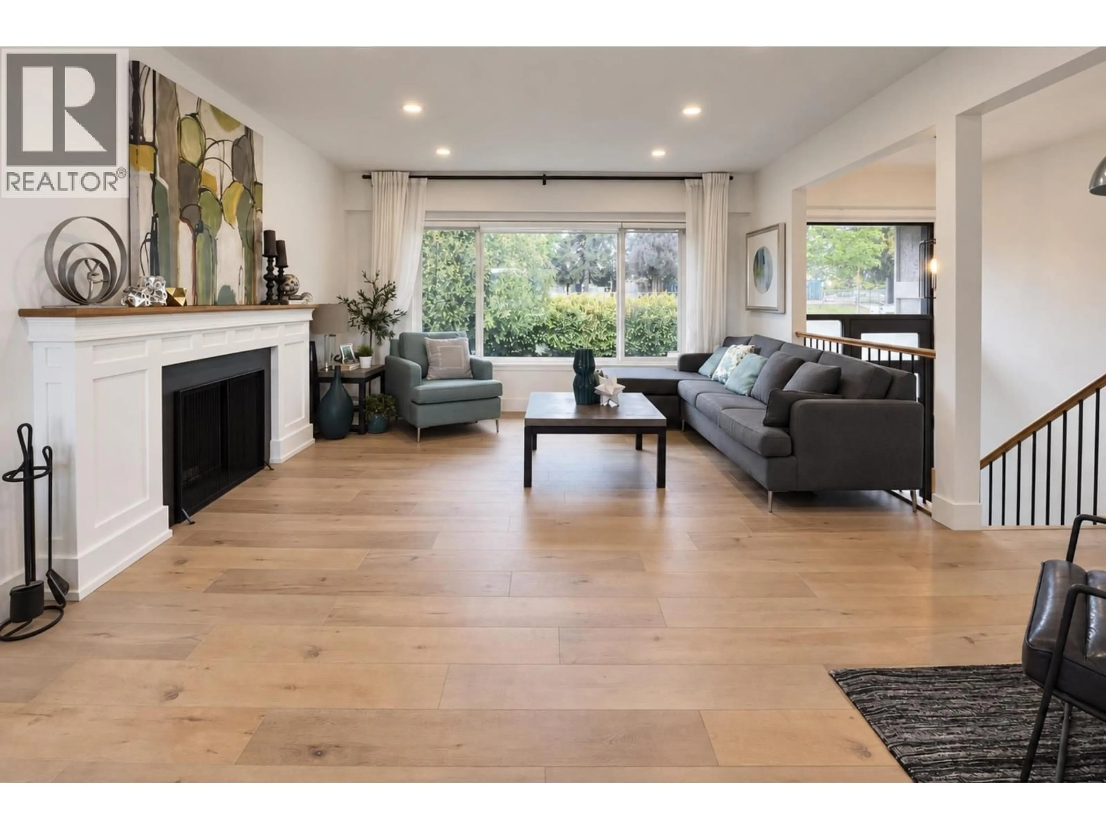 Living room with furniture, wood/laminate floor for 1070 STRATFORD AVENUE, Burnaby British Columbia V5B3X8