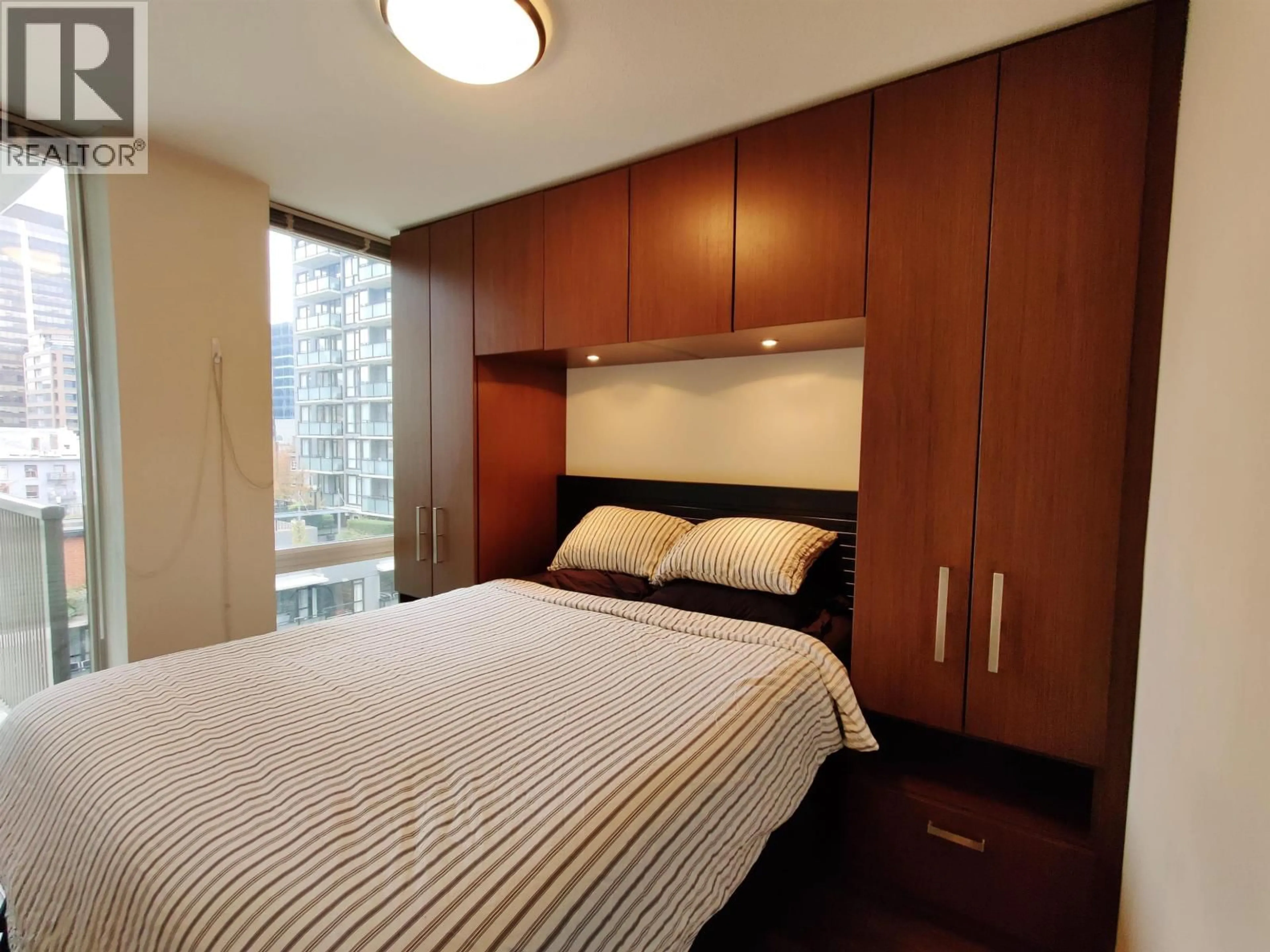 Bedroom with bed, wood/laminate floor for 1002 - 1055 RICHARDS STREET, Vancouver British Columbia V6B0C2