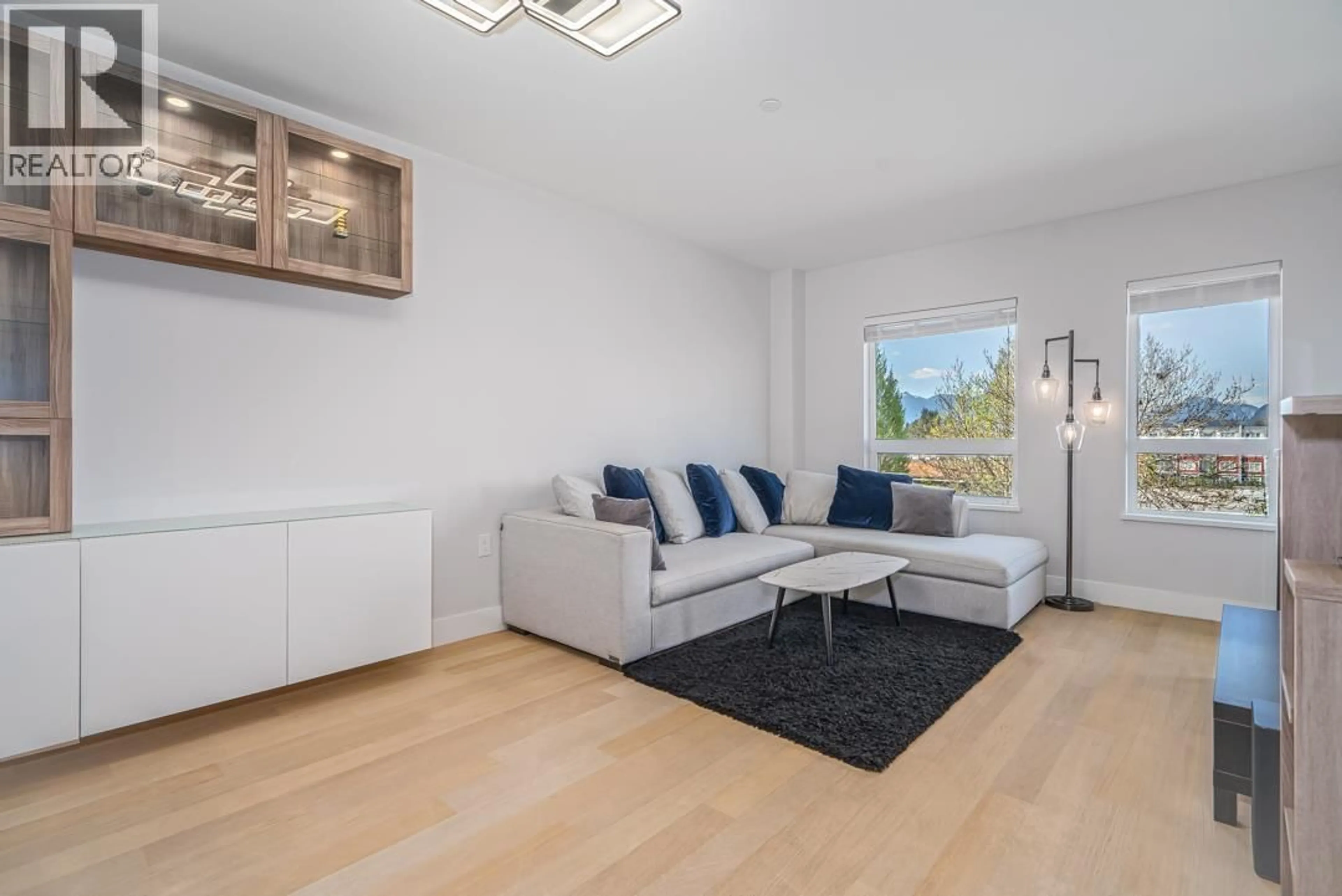 Living room with furniture, wood/laminate floor for 303 - 22226 BROWN AVENUE, Maple Ridge British Columbia V2X4R2