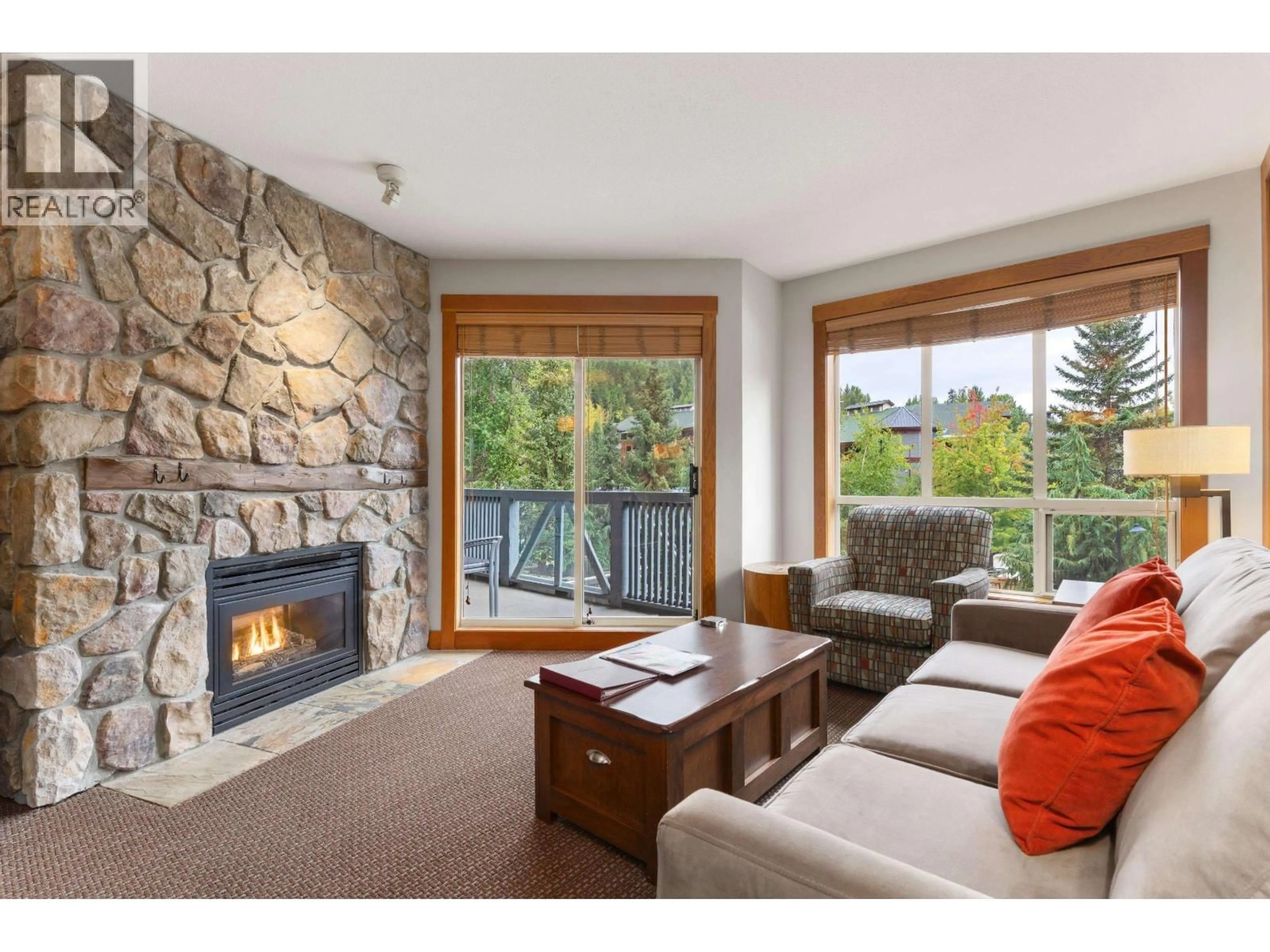 Living room with furniture, wood/laminate floor for 331B - 2036 LONDON LANE, Whistler British Columbia V8E0B6
