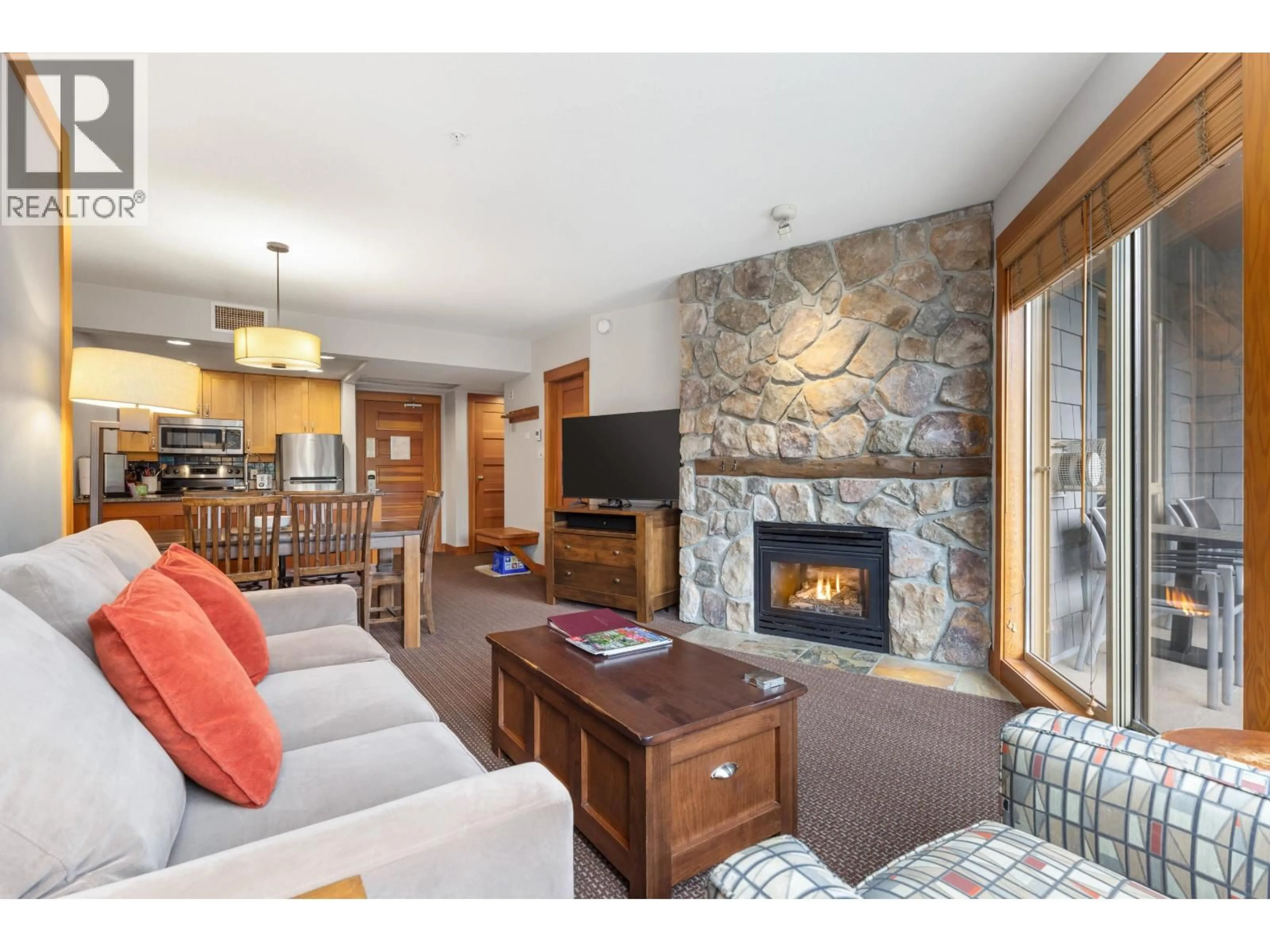 Living room with furniture, wood/laminate floor for 331B - 2036 LONDON LANE, Whistler British Columbia V8E0B6