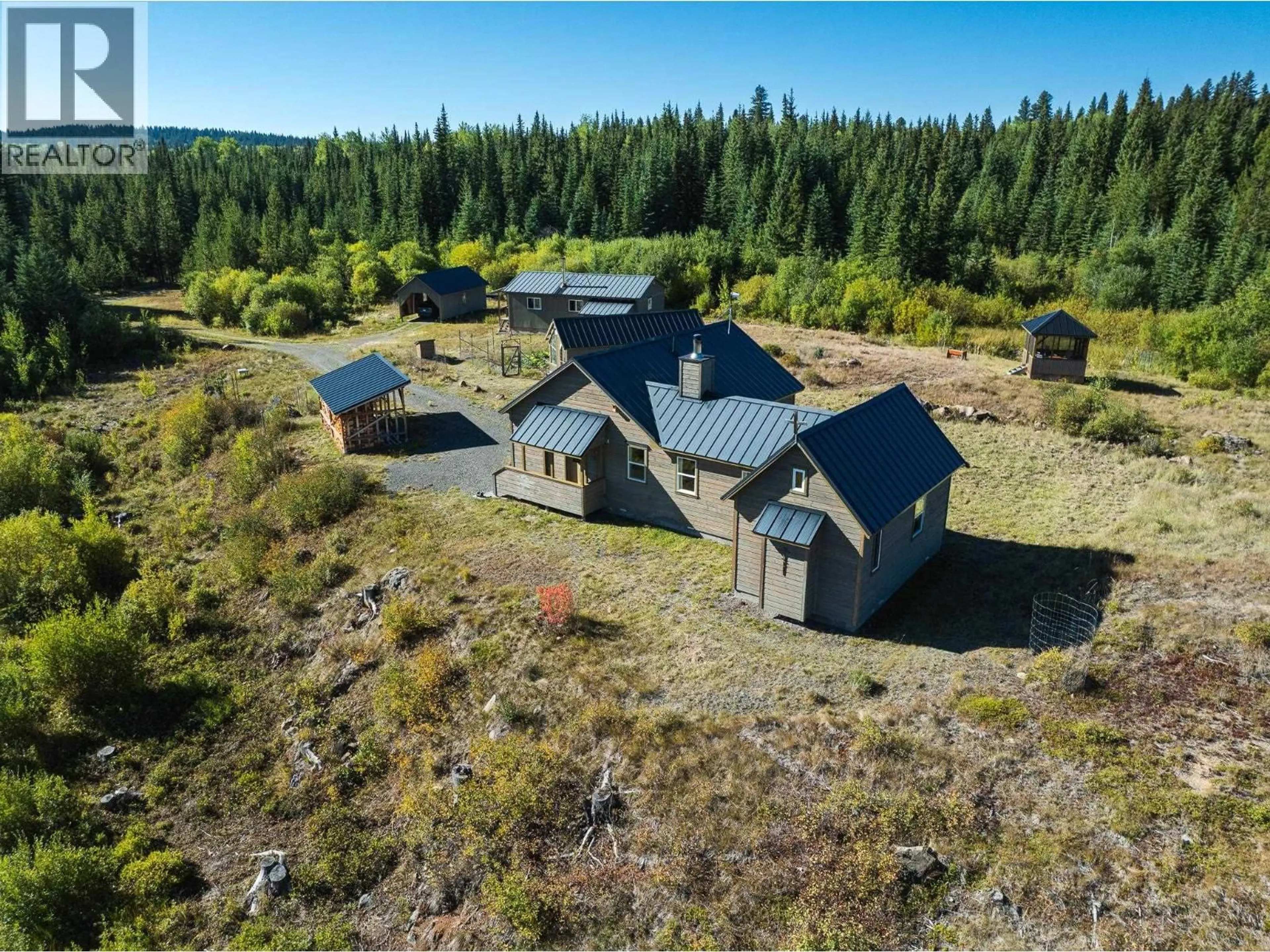 A pic from outside/outdoor area/front of a property/back of a property/a pic from drone, unknown for 7568 HIGH COUNTRY ROAD, Bridge Lake British Columbia V0K1X2