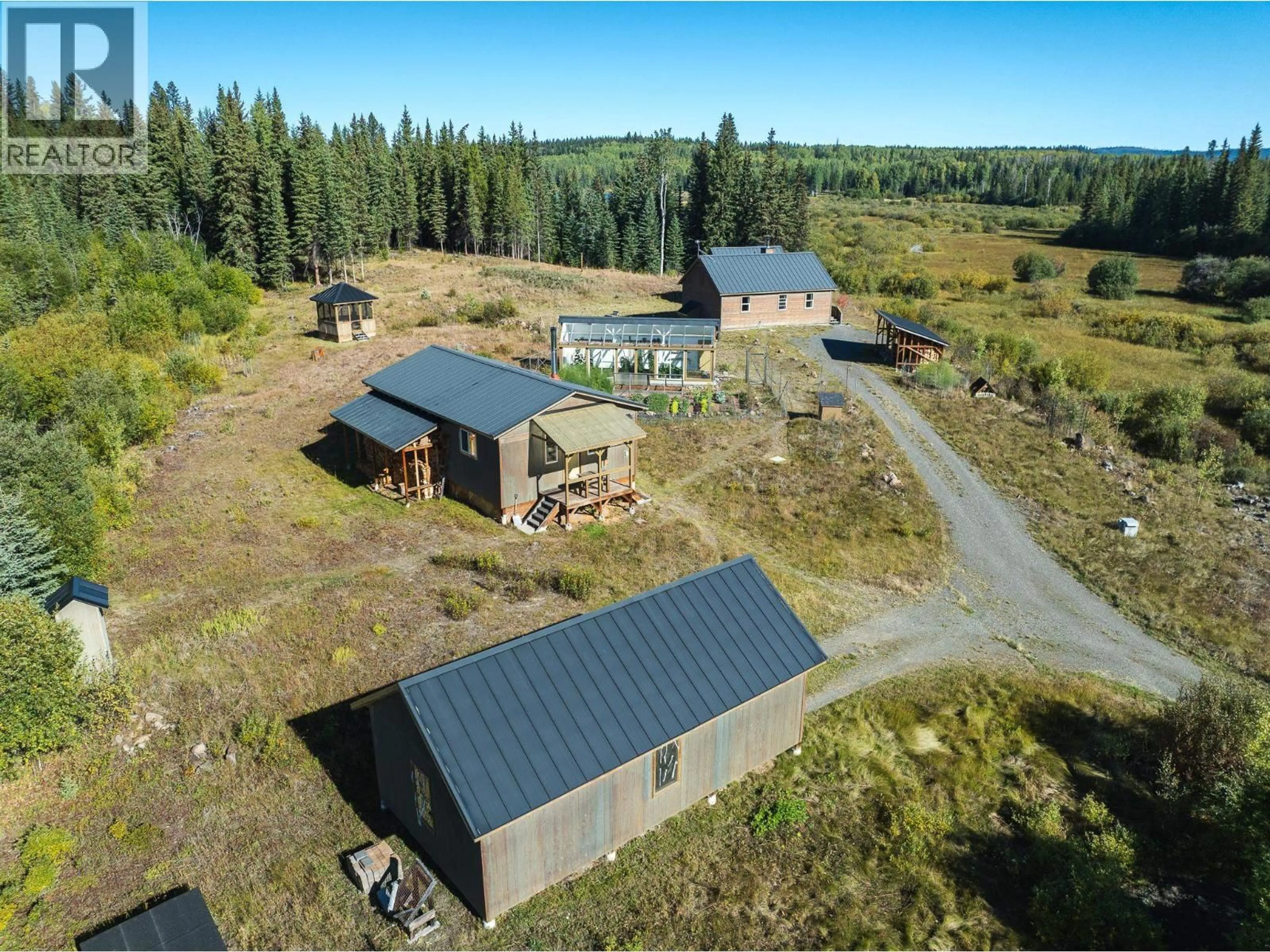 A pic from outside/outdoor area/front of a property/back of a property/a pic from drone, building for 7568 HIGH COUNTRY ROAD, Bridge Lake British Columbia V0K1X2