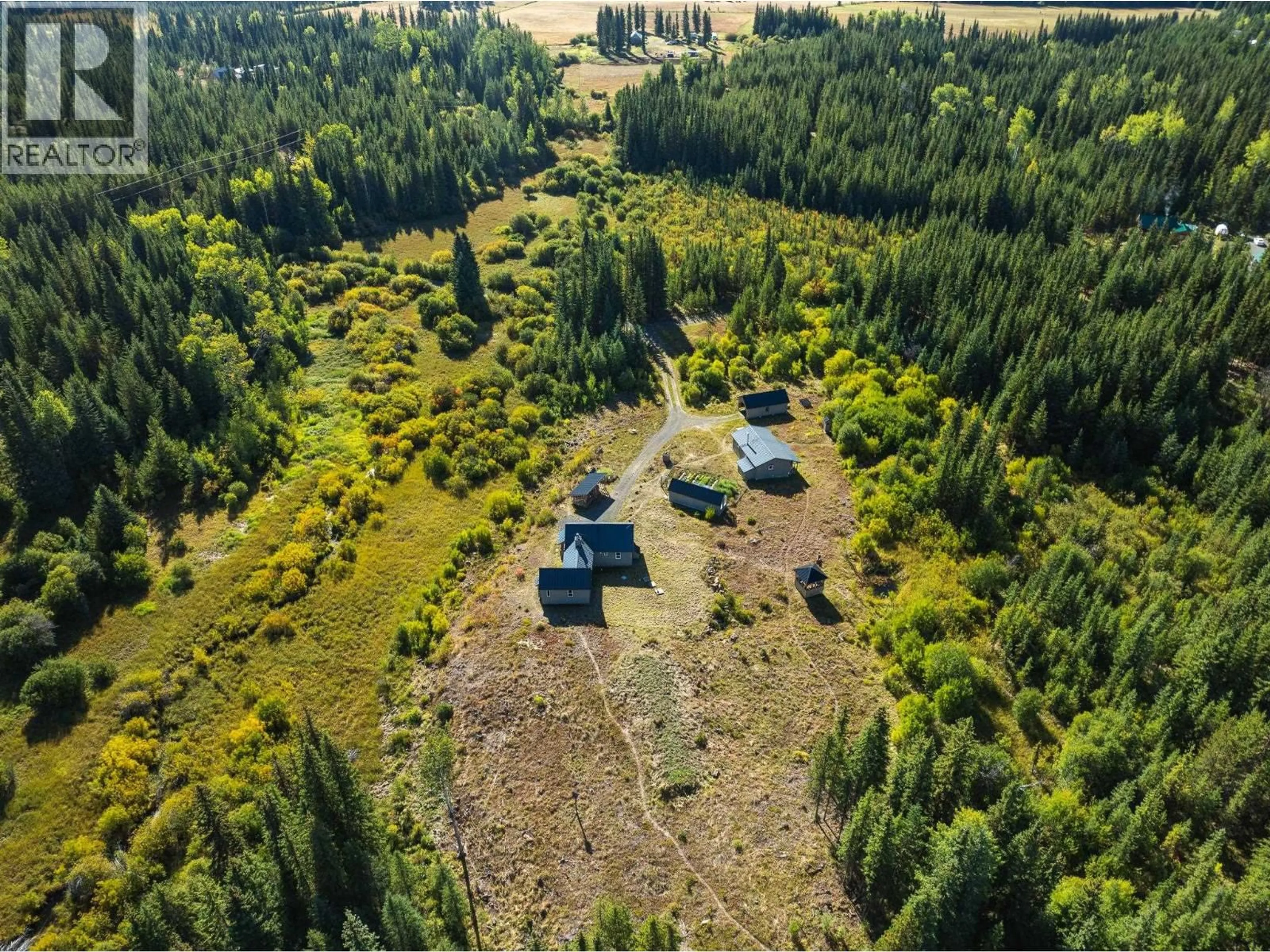 A pic from outside/outdoor area/front of a property/back of a property/a pic from drone, forest/trees view for 7568 HIGH COUNTRY ROAD, Bridge Lake British Columbia V0K1X2