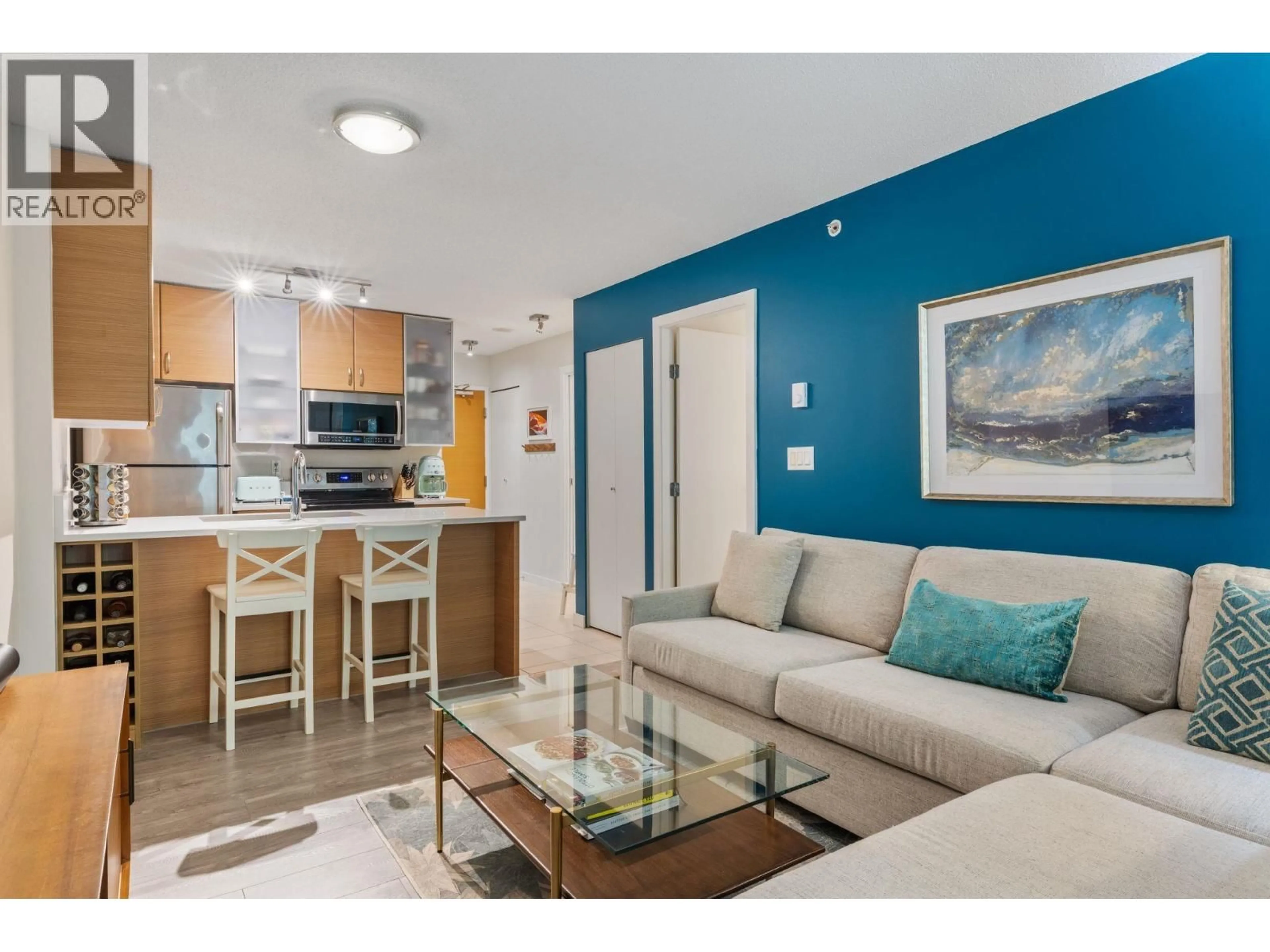 Living room with furniture, wood/laminate floor for 306 - 977 MAINLAND STREET, Vancouver British Columbia V6B1T2