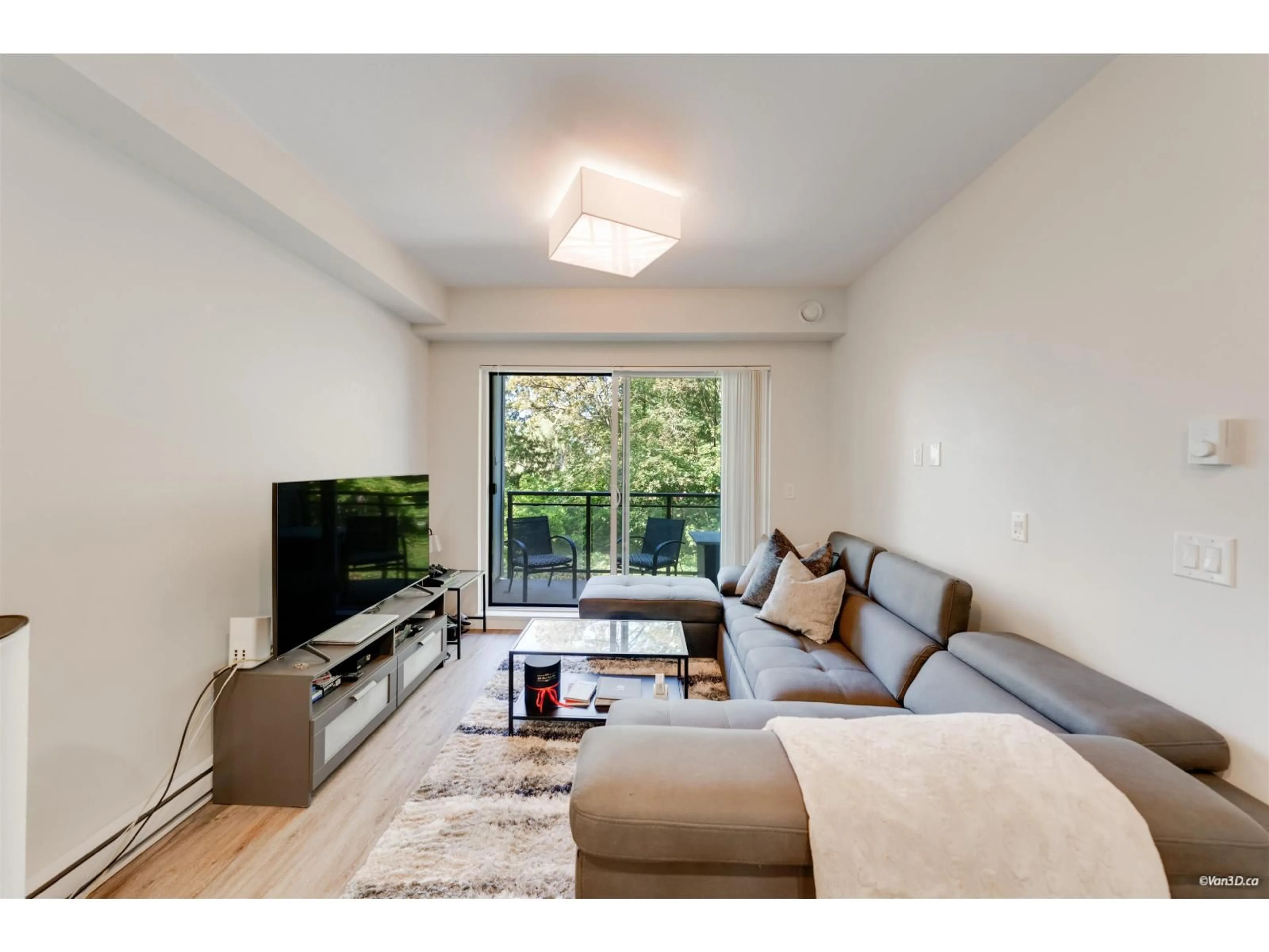 Living room with furniture, wood/laminate floor for A207 - 20087 68 AVENUE, Langley British Columbia V2Y0Y2