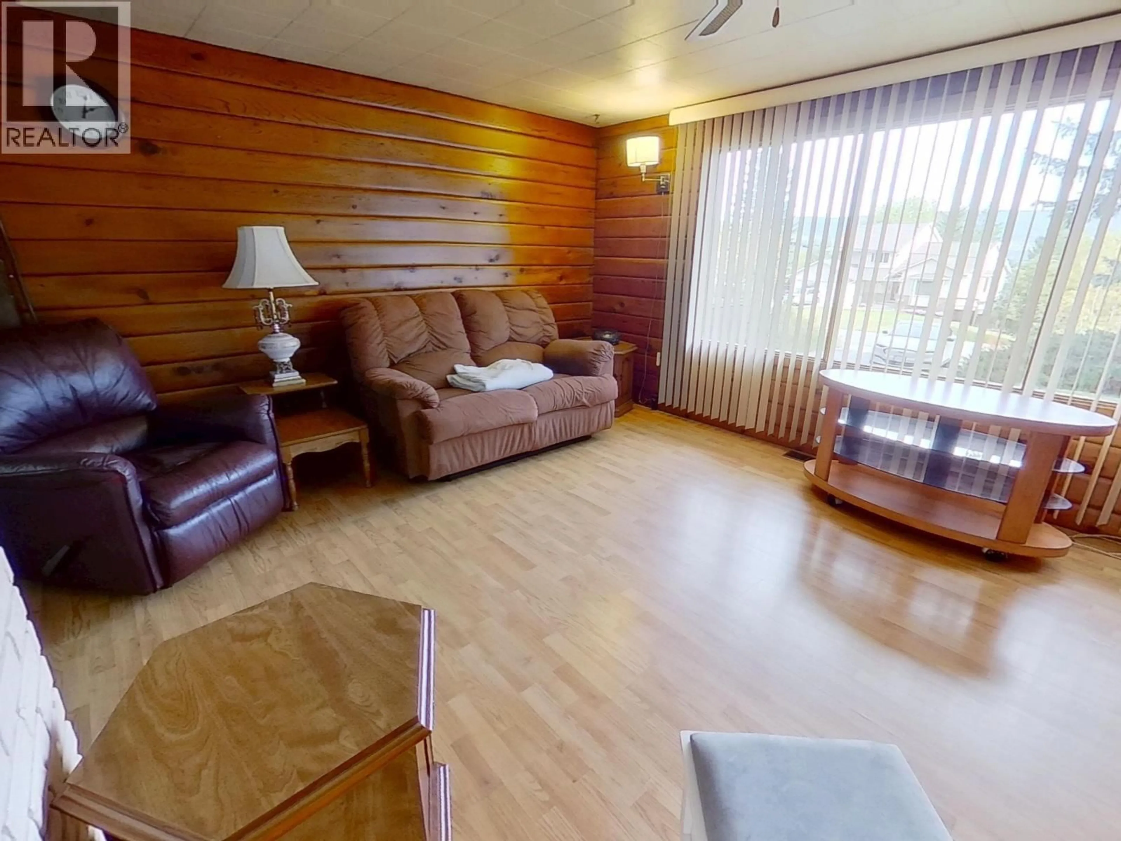 Living room with furniture, wood/laminate floor for 1817 MARBLE STREET, Quesnel British Columbia V2J4M5