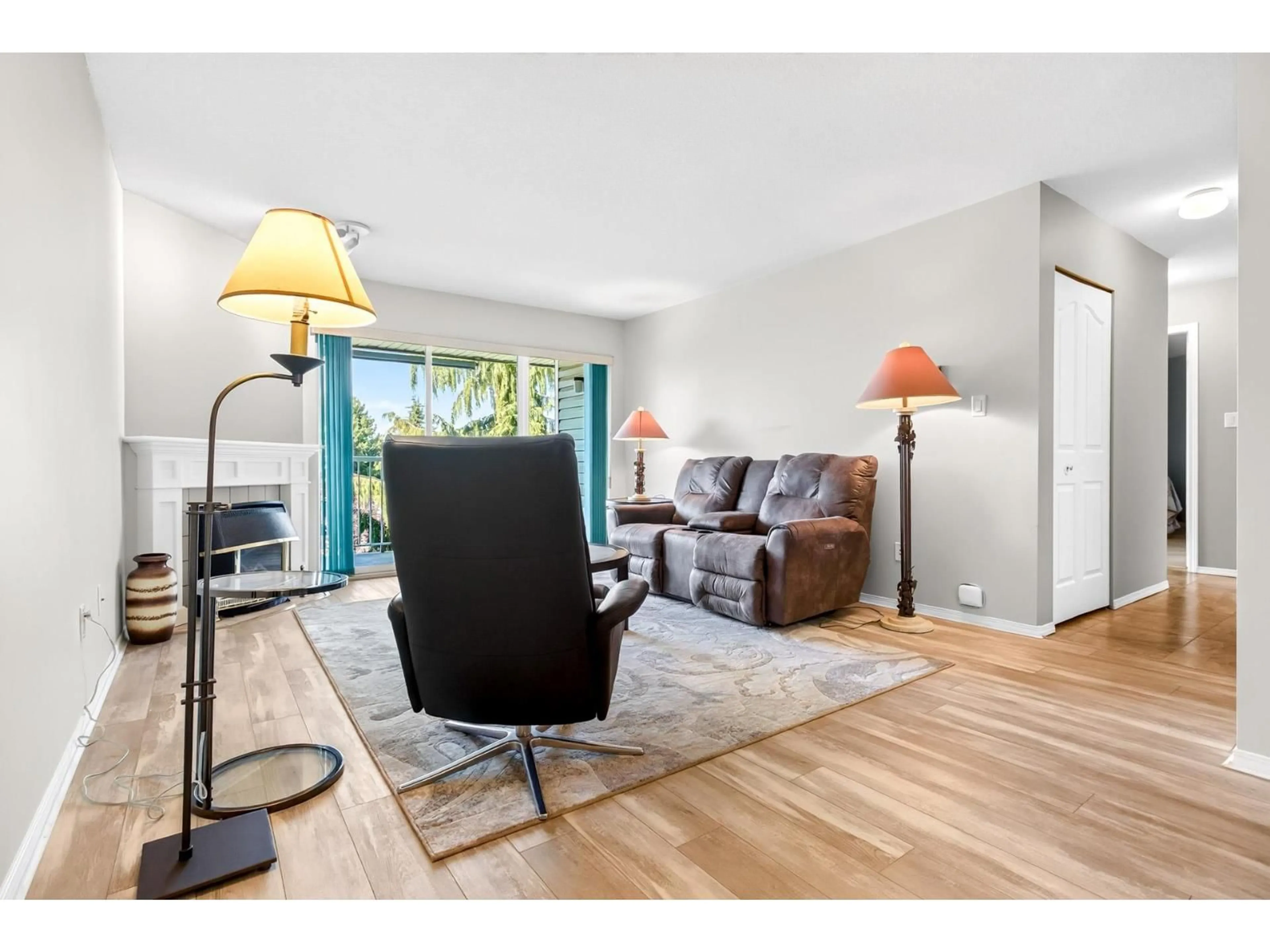 Living room with furniture, wood/laminate floor for 305 - 5360 205 STREET, Langley British Columbia V3A7Y6