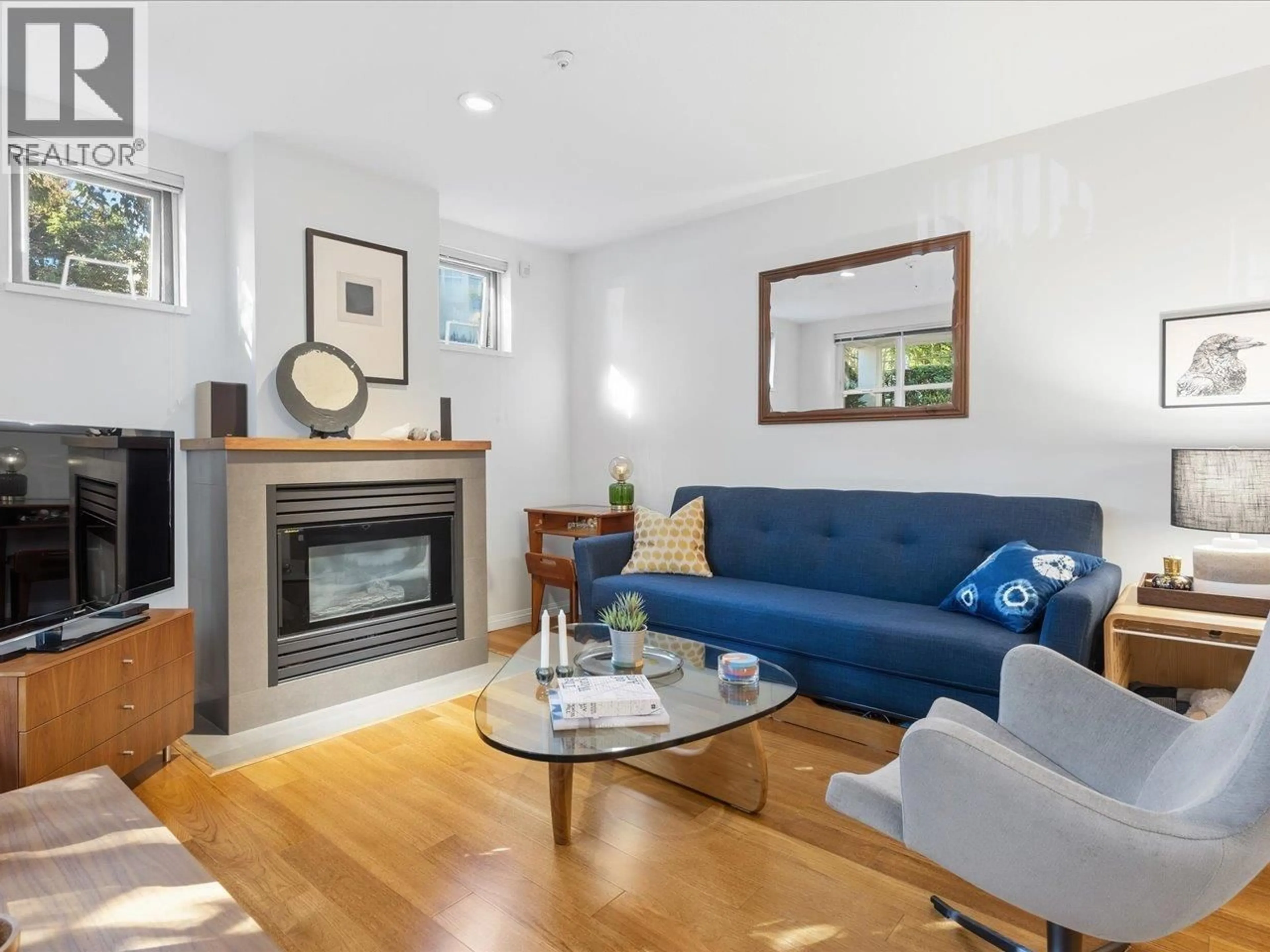 Living room with furniture, wood/laminate floor for 101 - 685 7TH AVENUE, Vancouver British Columbia V5Z1B6