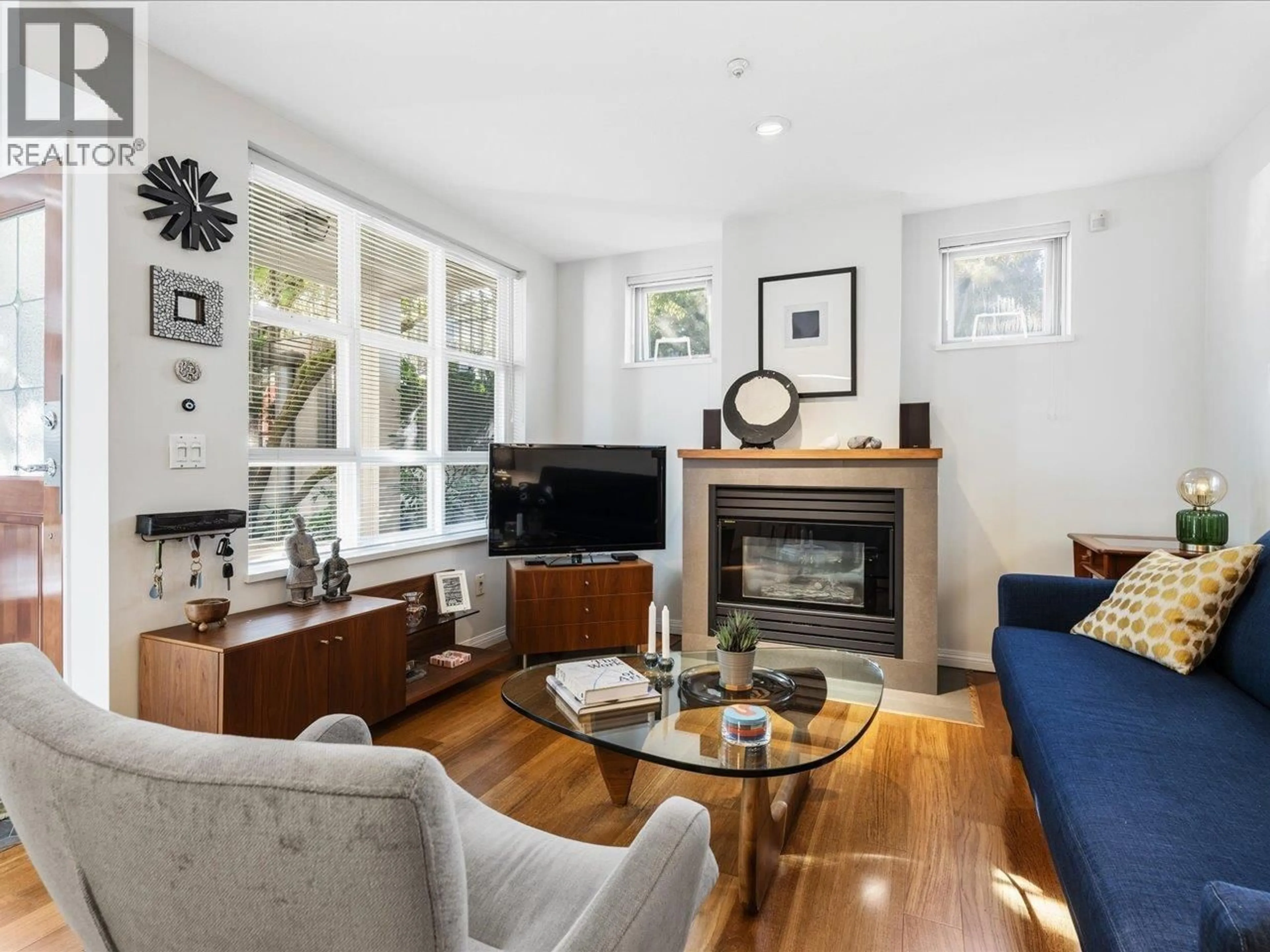 Living room with furniture, wood/laminate floor for 101 - 685 7TH AVENUE, Vancouver British Columbia V5Z1B6