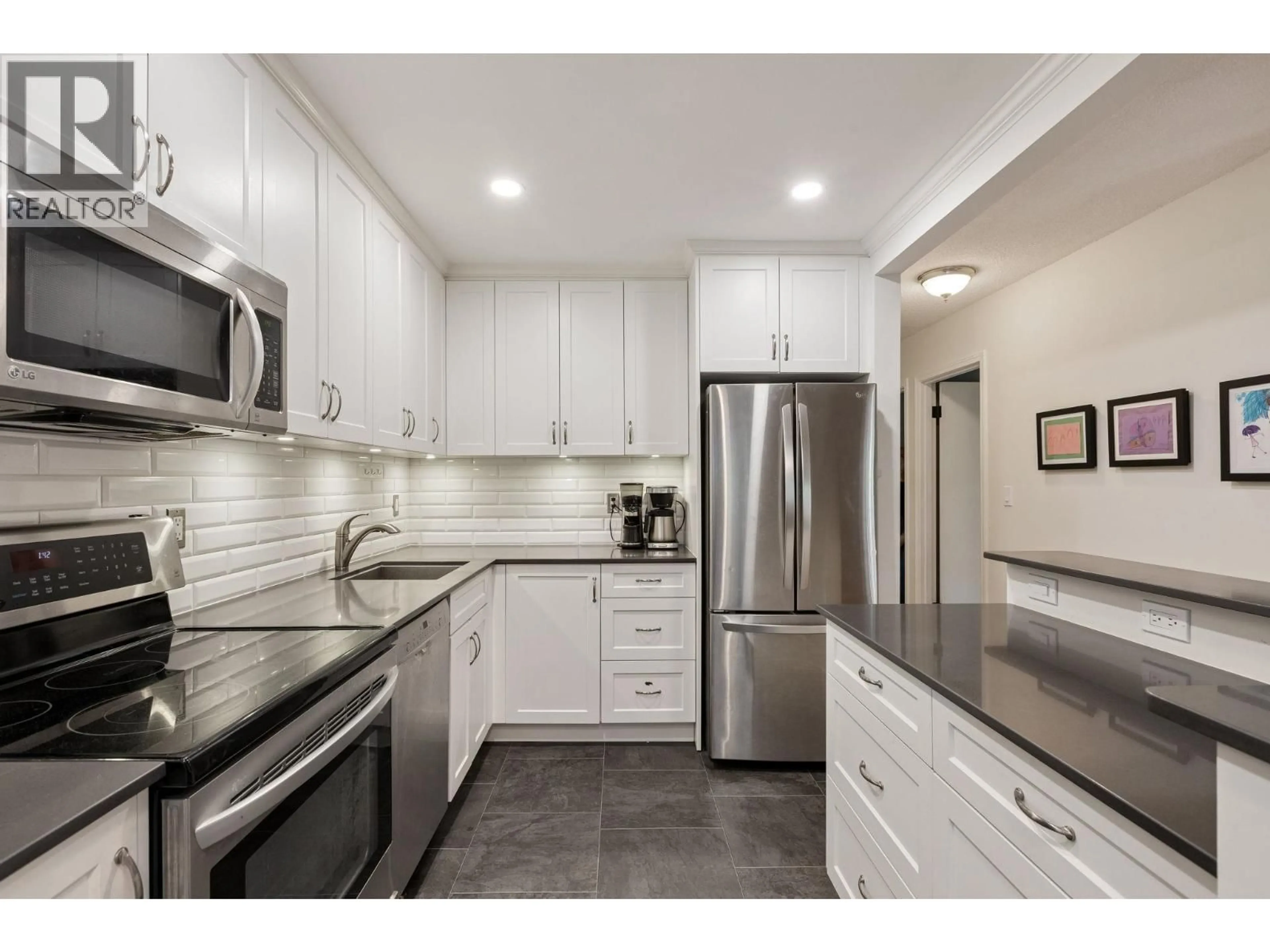 Open concept kitchen, ceramic/tile floor for 209 - 310 3RD STREET, North Vancouver British Columbia V7L1E9