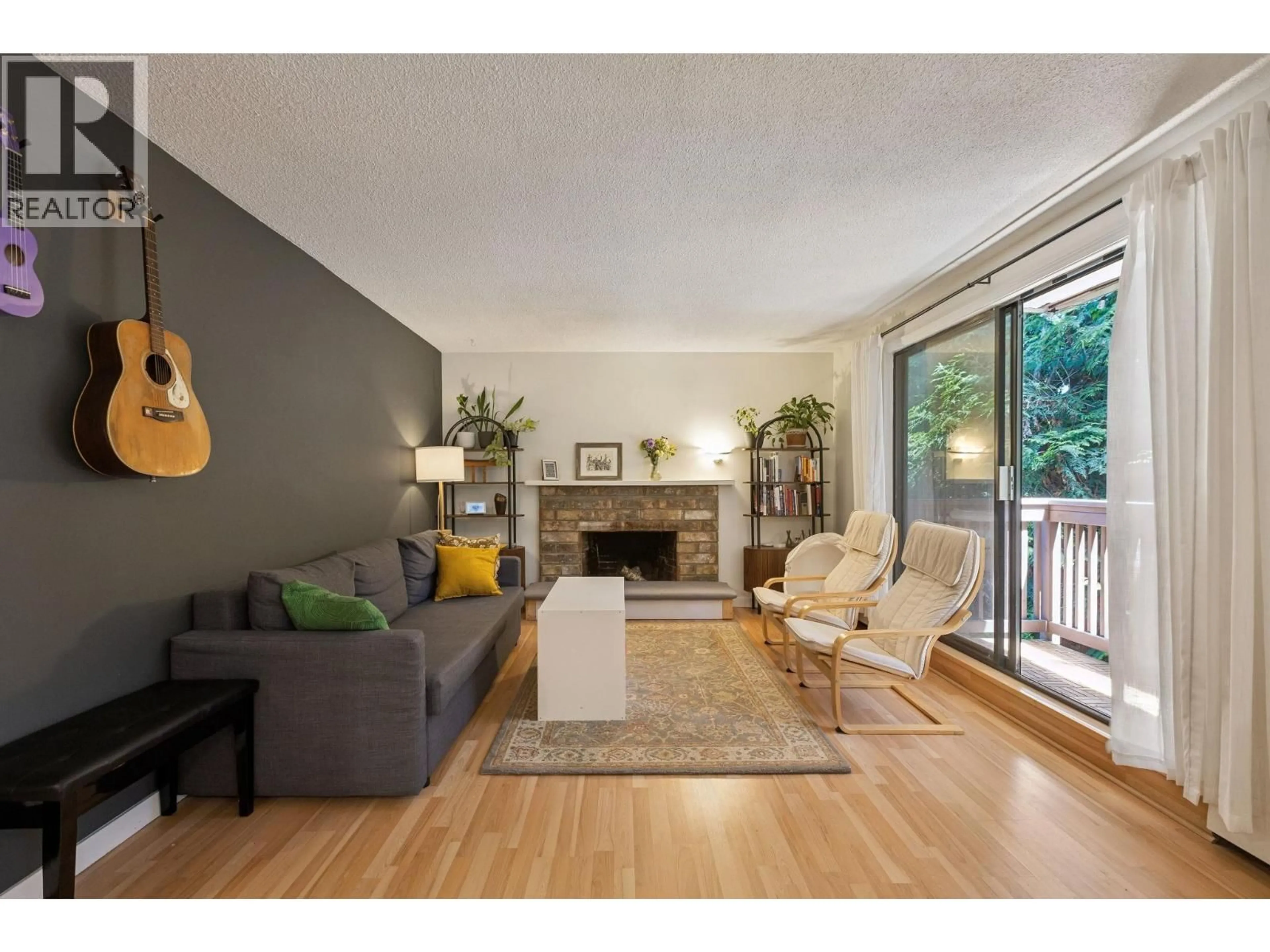 Living room with furniture, wood/laminate floor for 209 - 310 3RD STREET, North Vancouver British Columbia V7L1E9