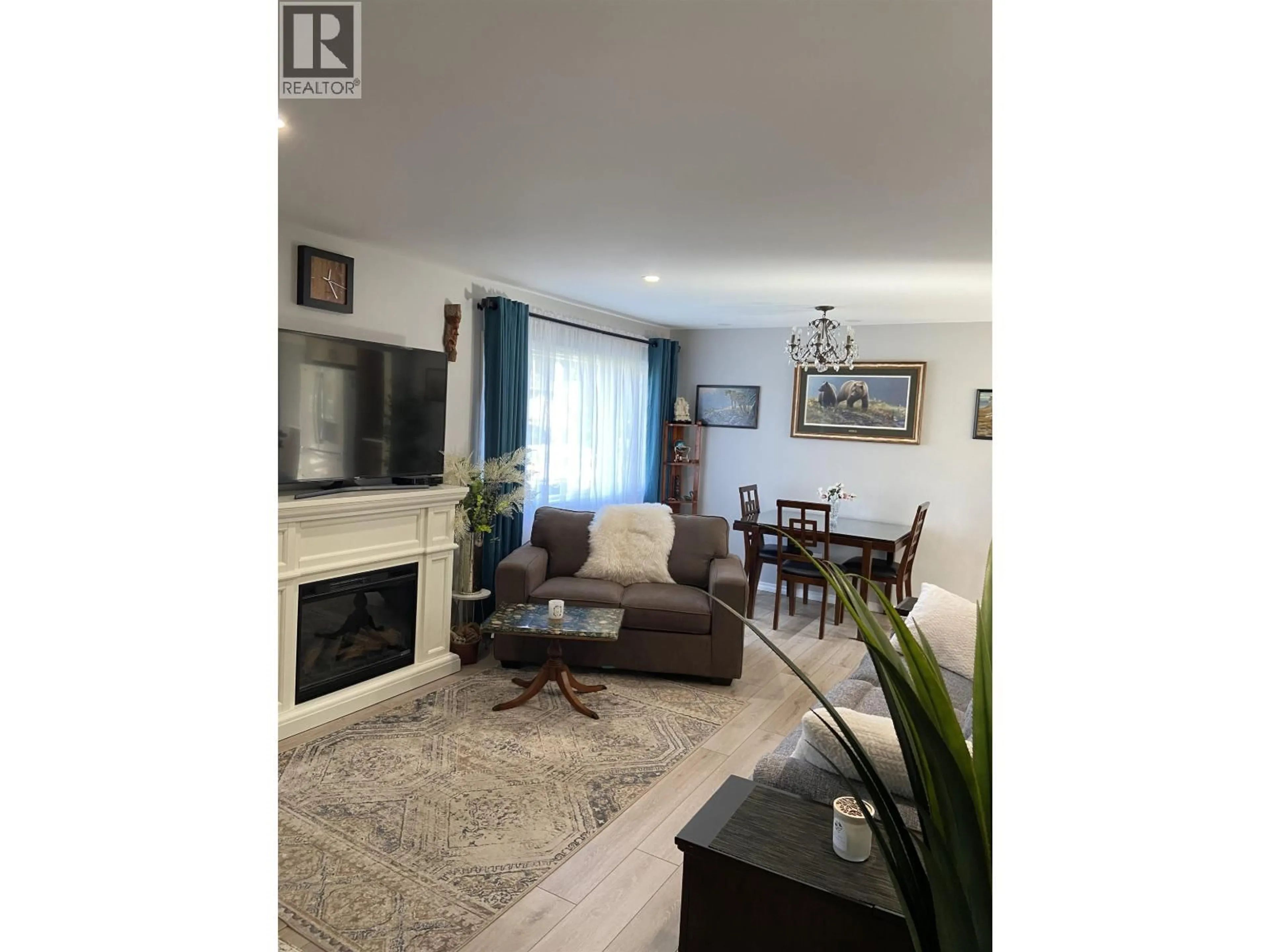Living room with furniture, wood/laminate floor for 4719 OLSON AVENUE, Terrace British Columbia V8G2A4