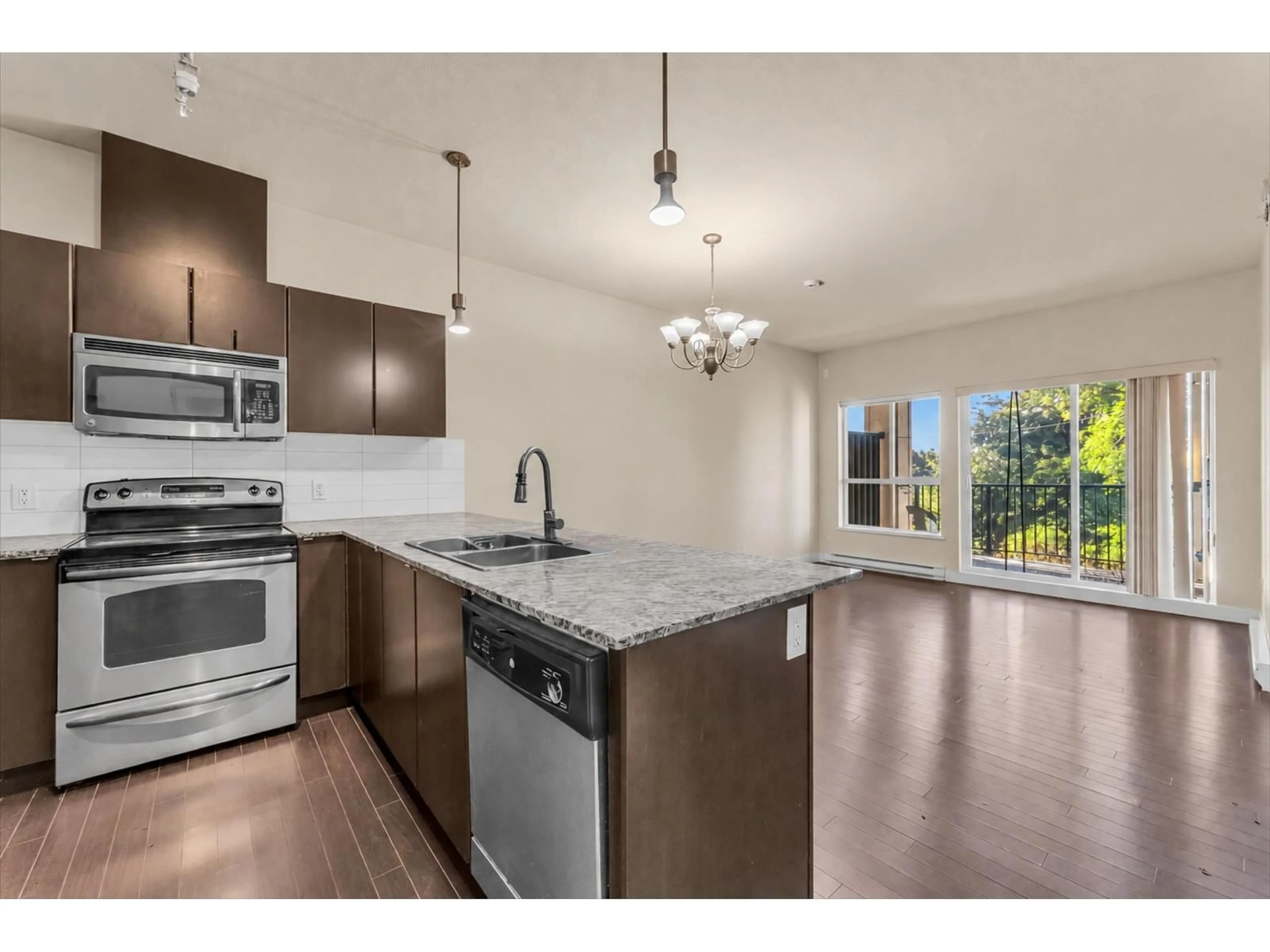 Open concept kitchen, unknown for 409 - 9655 KING GEORGE BOULEVARD, Surrey British Columbia V3T0C7