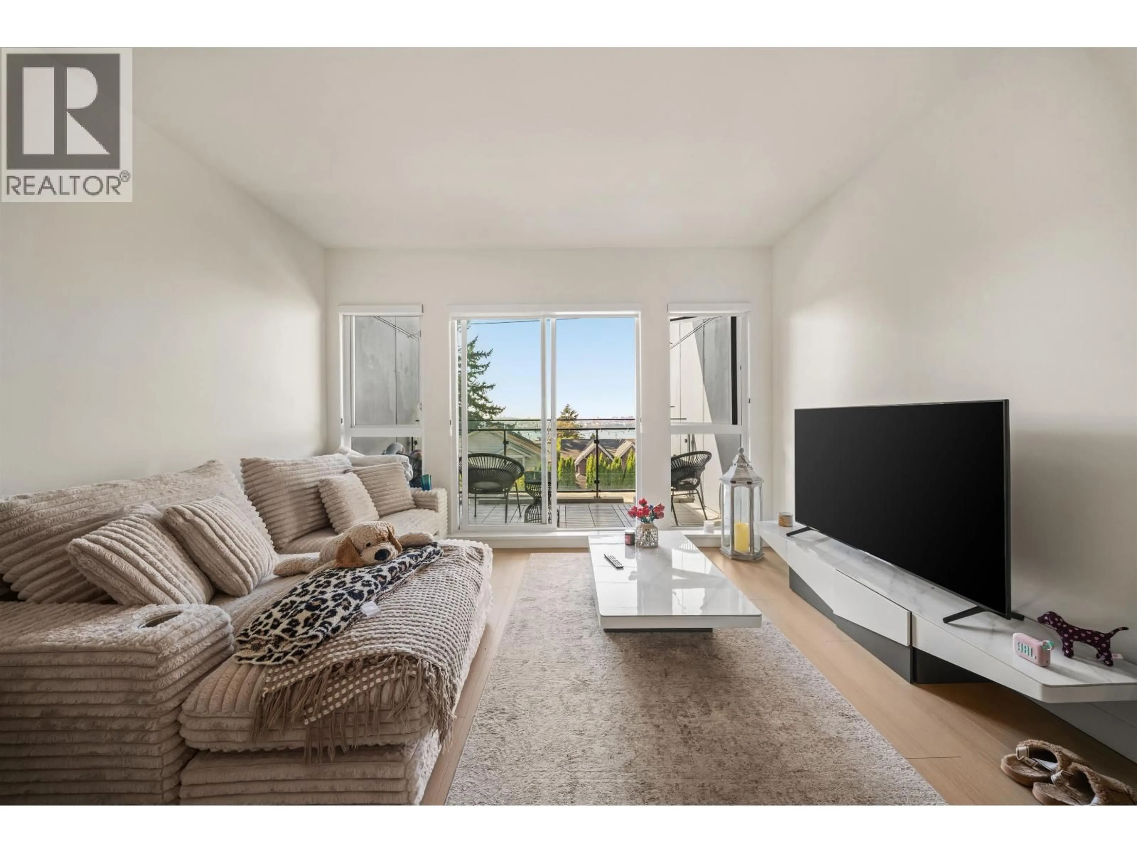 Living room with furniture, wood/laminate floor for 309 - 422 3RD STREET, North Vancouver British Columbia V7L0K1