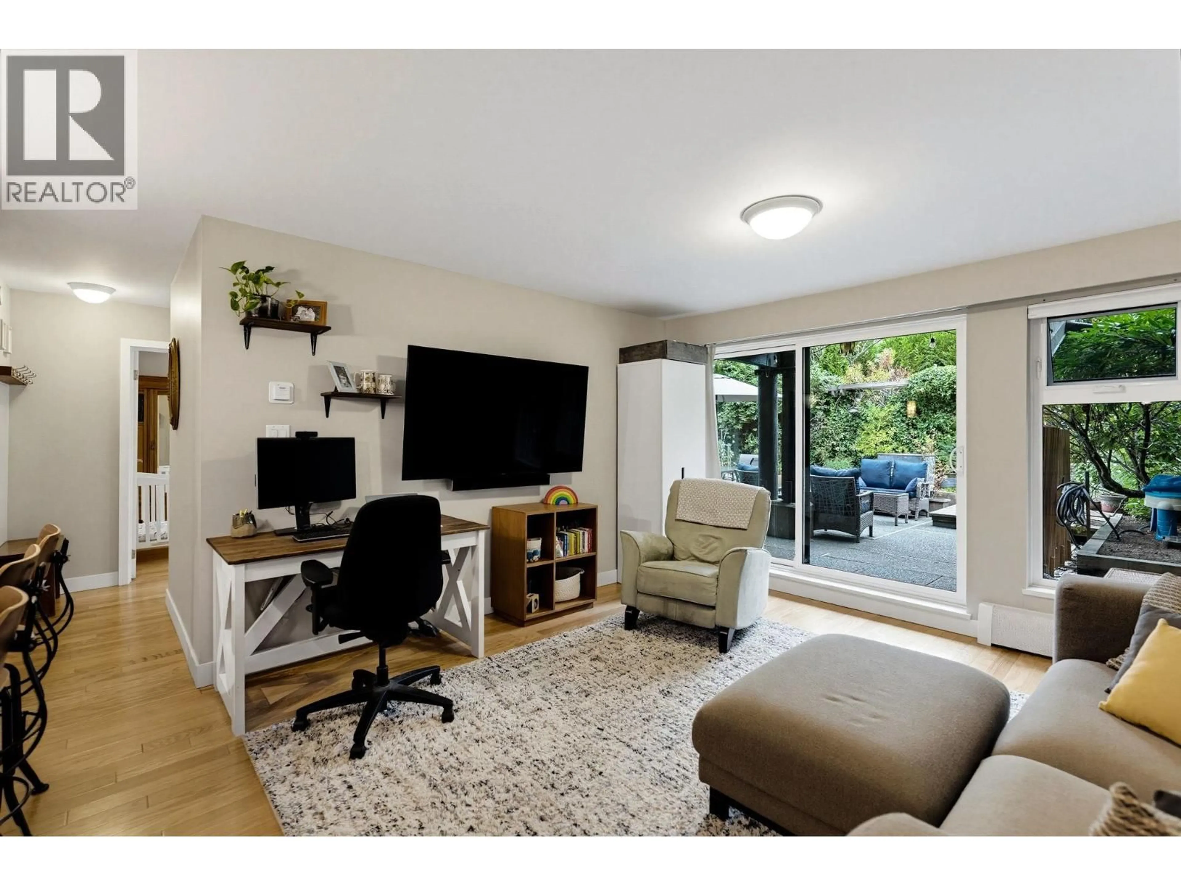 Living room with furniture, wood/laminate floor for 204 - 7377 SALISBURY AVENUE, Burnaby British Columbia V5E4B2