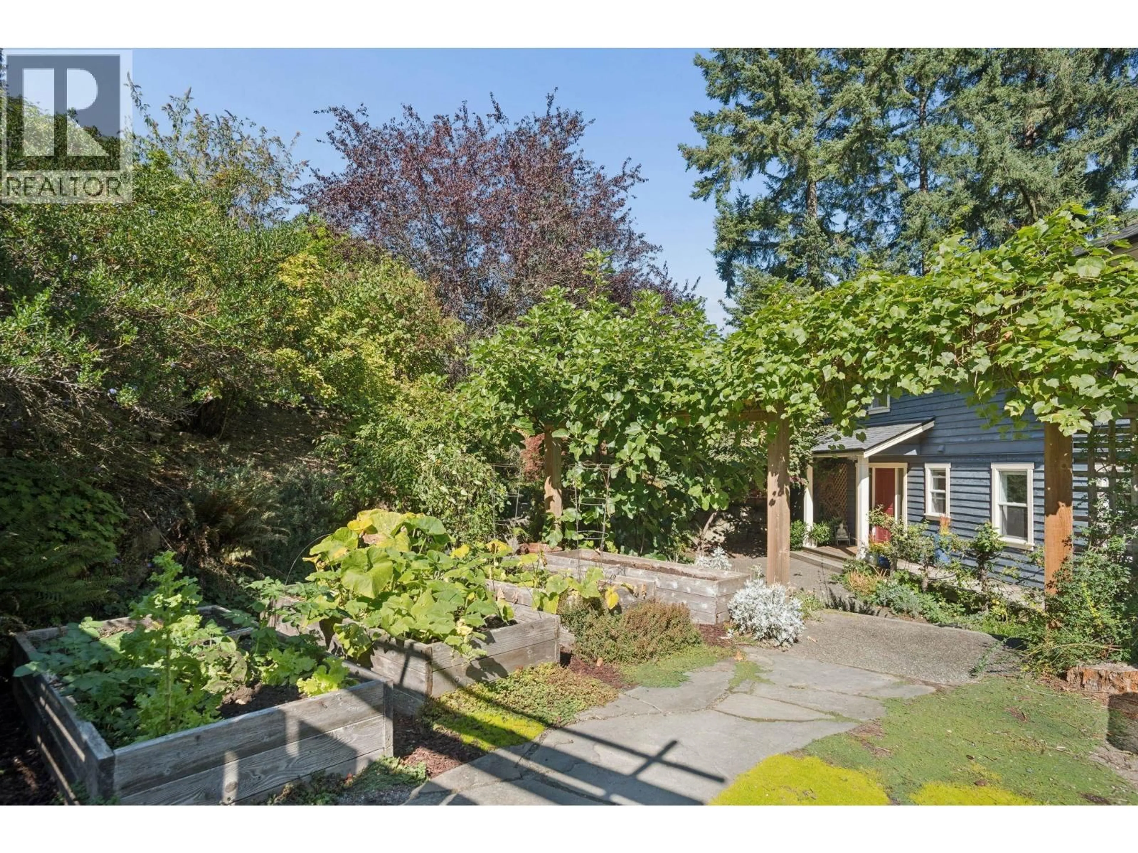 A pic from outside/outdoor area/front of a property/back of a property/a pic from drone, street for 965 VILLAGE DRIVE, Bowen Island British Columbia V0N1G1