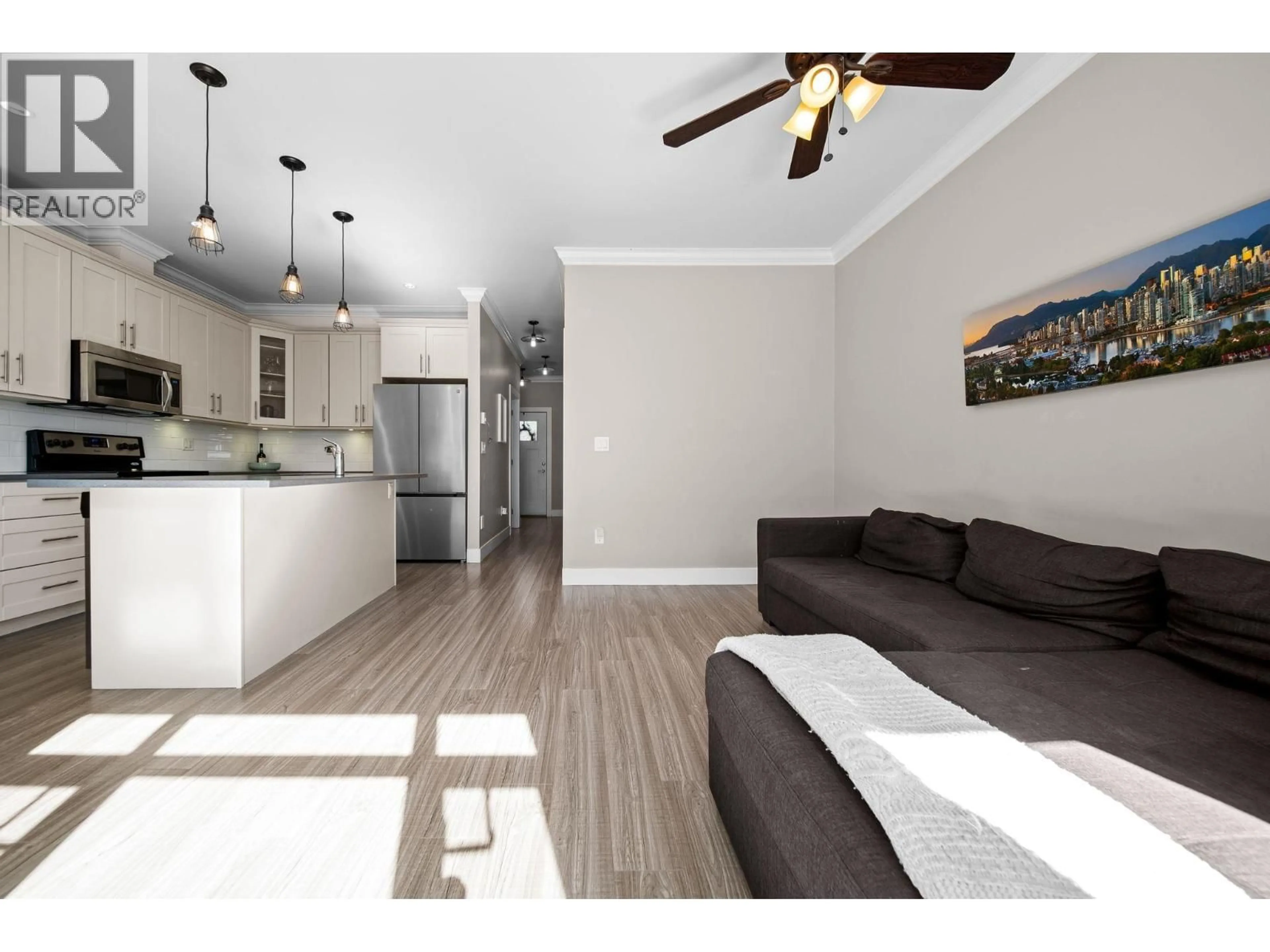 Living room with furniture, wood/laminate floor for 109 - 801 RODERICK AVENUE, Coquitlam British Columbia V3K1P7
