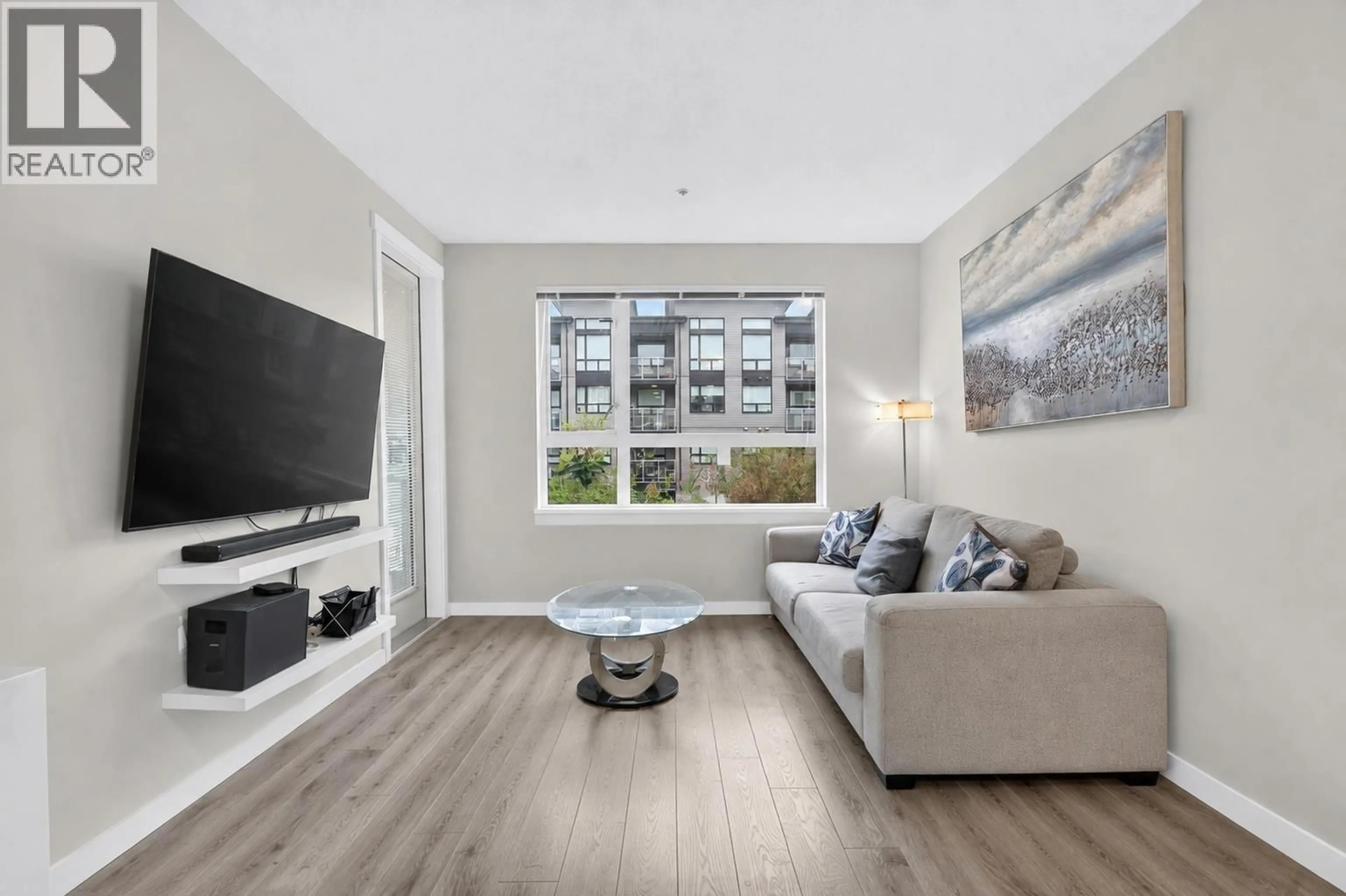 Living room with furniture, wood/laminate floor for 307 - 9233 ODLIN ROAD, Richmond British Columbia V6X0V4