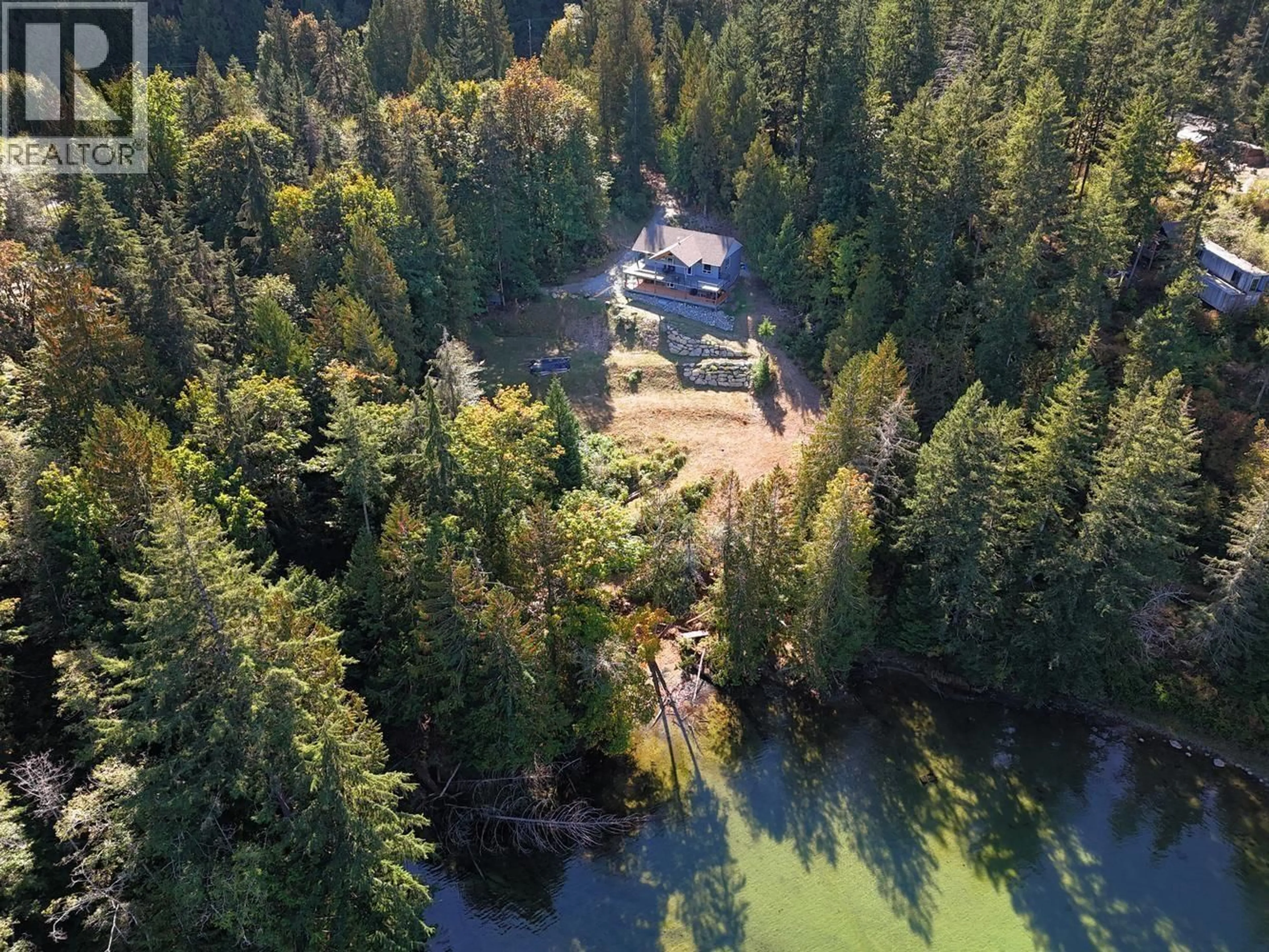 A pic from outside/outdoor area/front of a property/back of a property/a pic from drone, water/lake/river/ocean view for 5611 OYSTER BAY ROAD, Garden Bay British Columbia V0N2H1