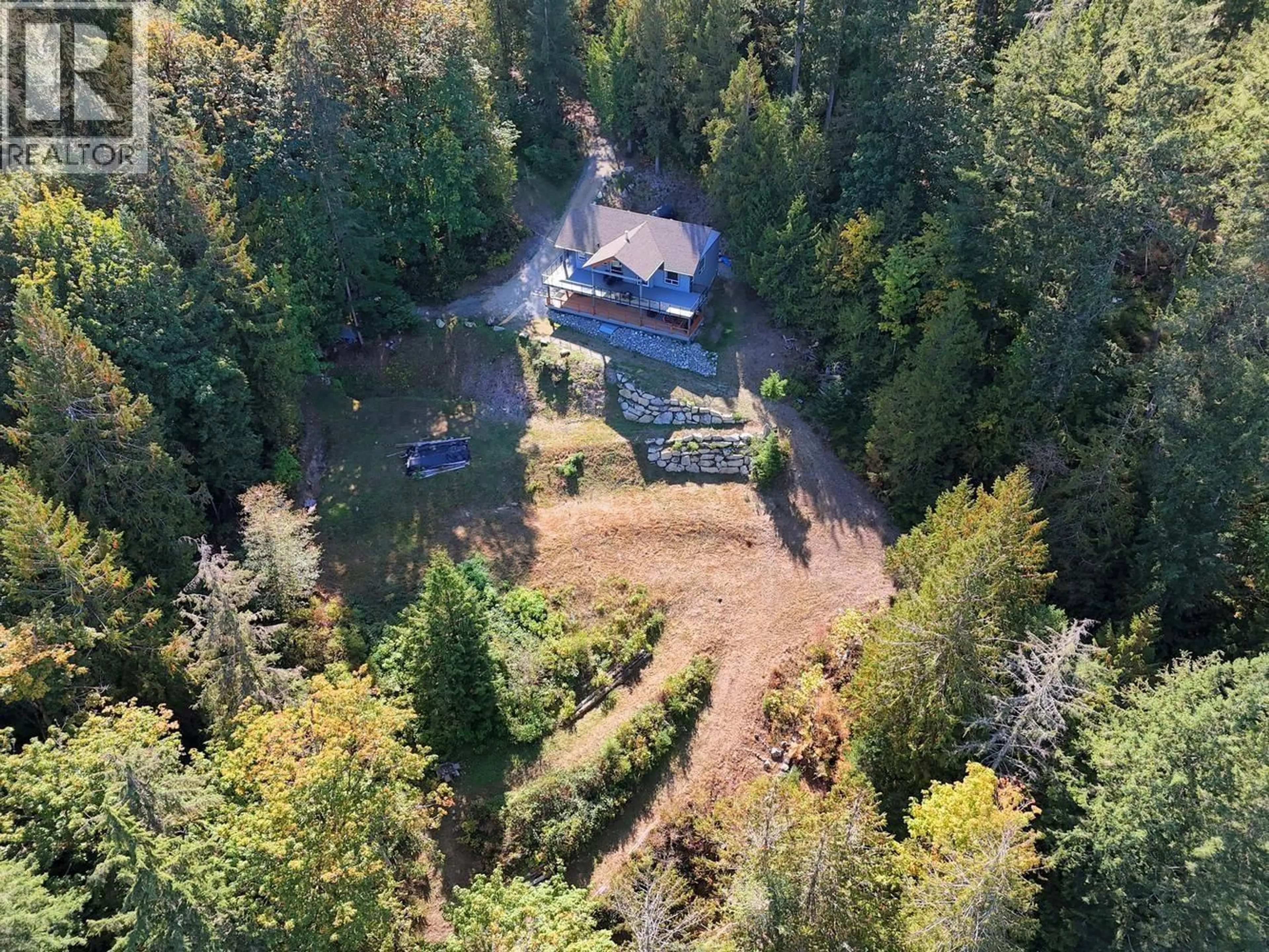 A pic from outside/outdoor area/front of a property/back of a property/a pic from drone, forest/trees view for 5611 OYSTER BAY ROAD, Garden Bay British Columbia V0N2H1