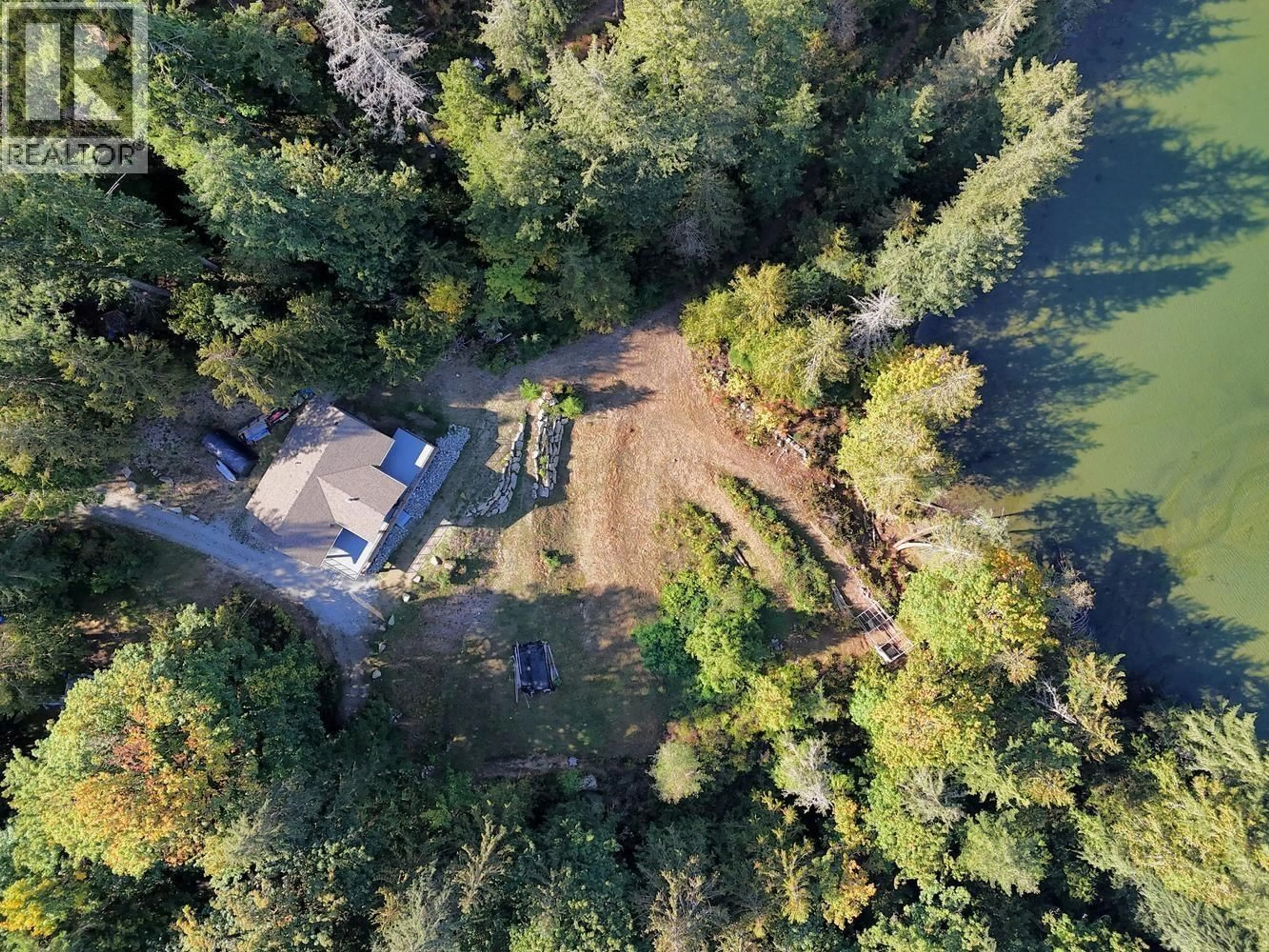 A pic from outside/outdoor area/front of a property/back of a property/a pic from drone, forest/trees view for 5611 OYSTER BAY ROAD, Garden Bay British Columbia V0N2H1