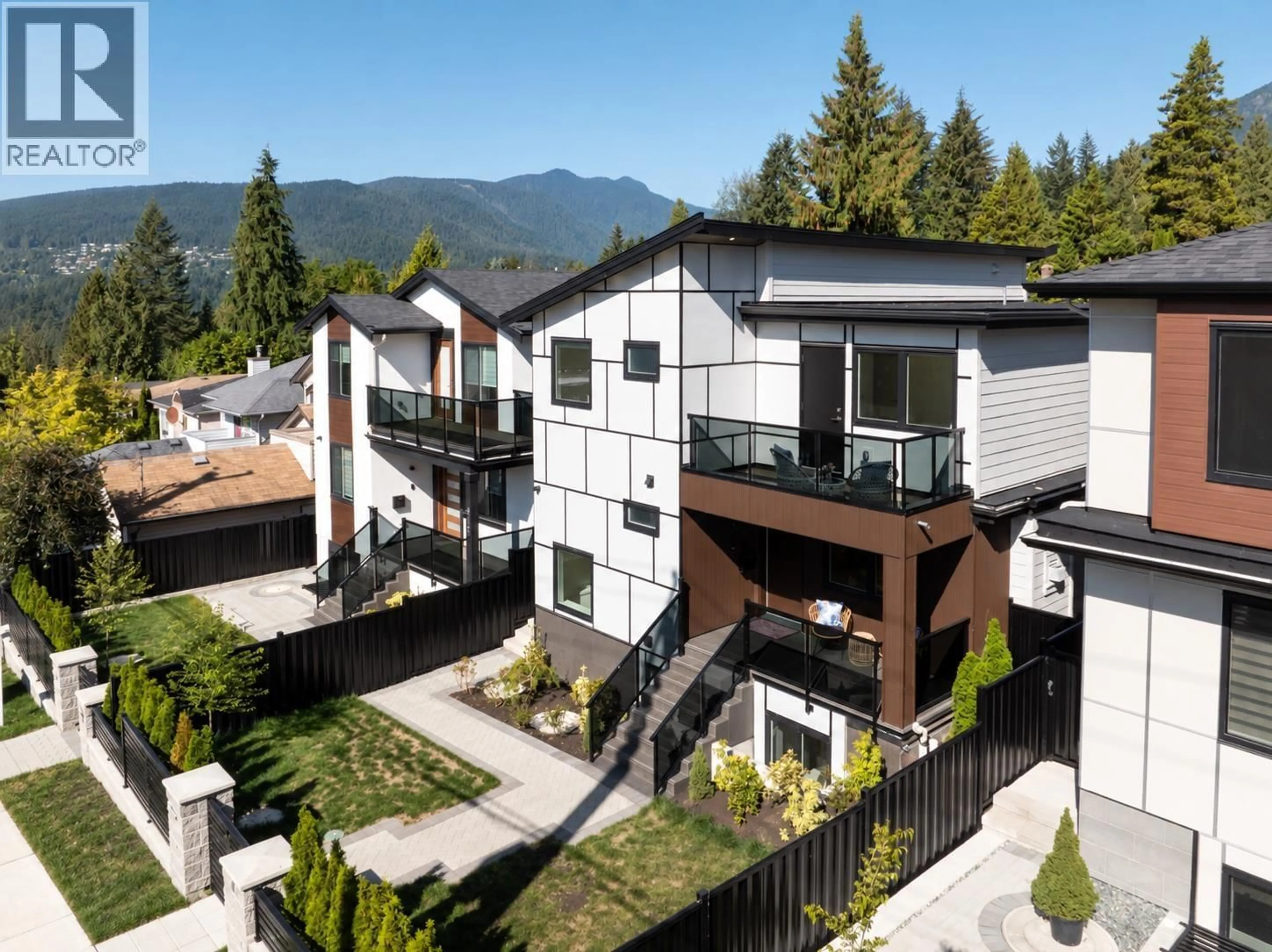 A pic from outside/outdoor area/front of a property/back of a property/a pic from drone, mountain view for 806 MONTROYAL BOULEVARD, North Vancouver British Columbia V7R2G6