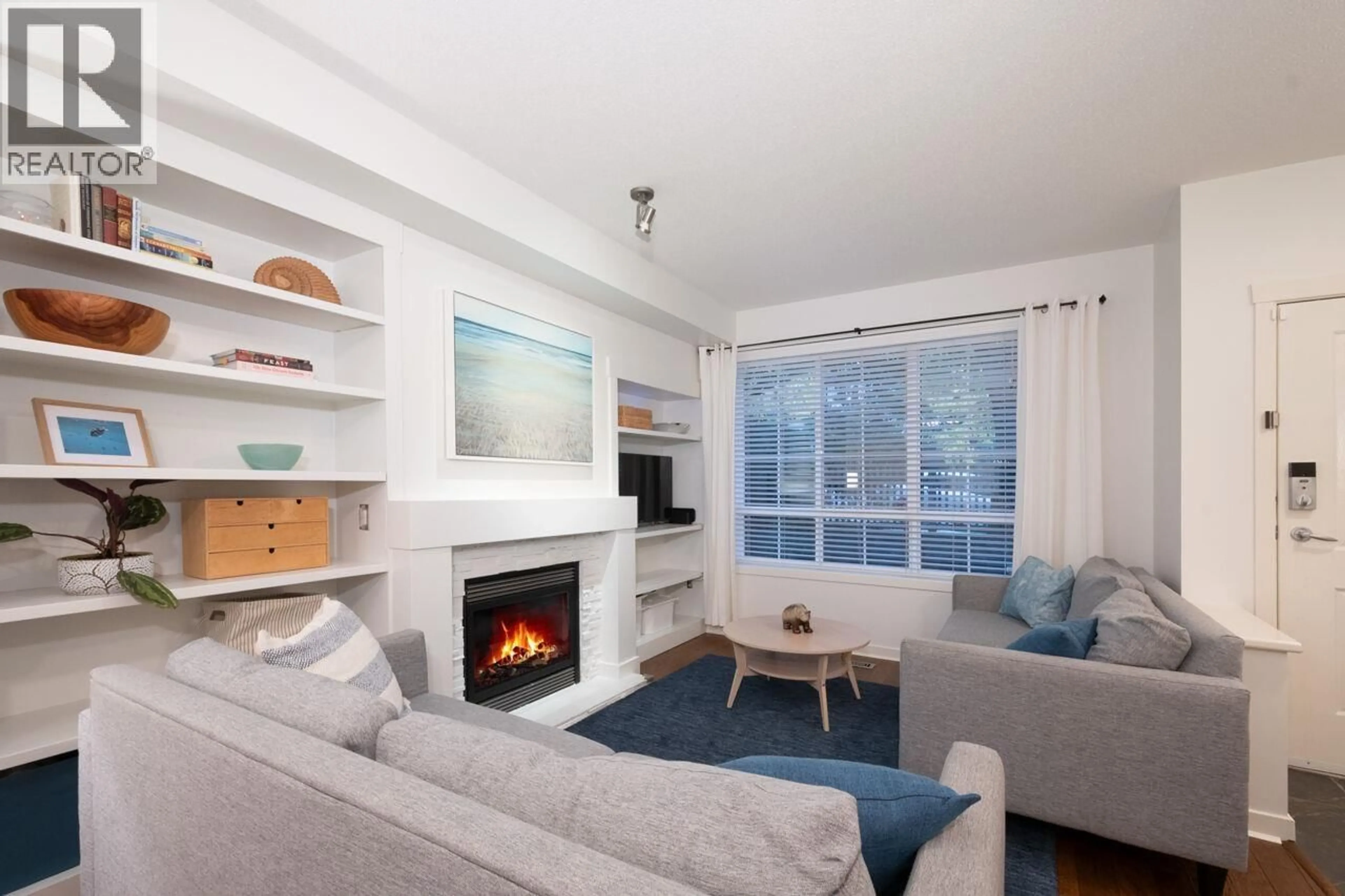 Living room with furniture, wood/laminate floor for 108 - 2200 PANORAMA DRIVE, Port Moody British Columbia V3H5M2
