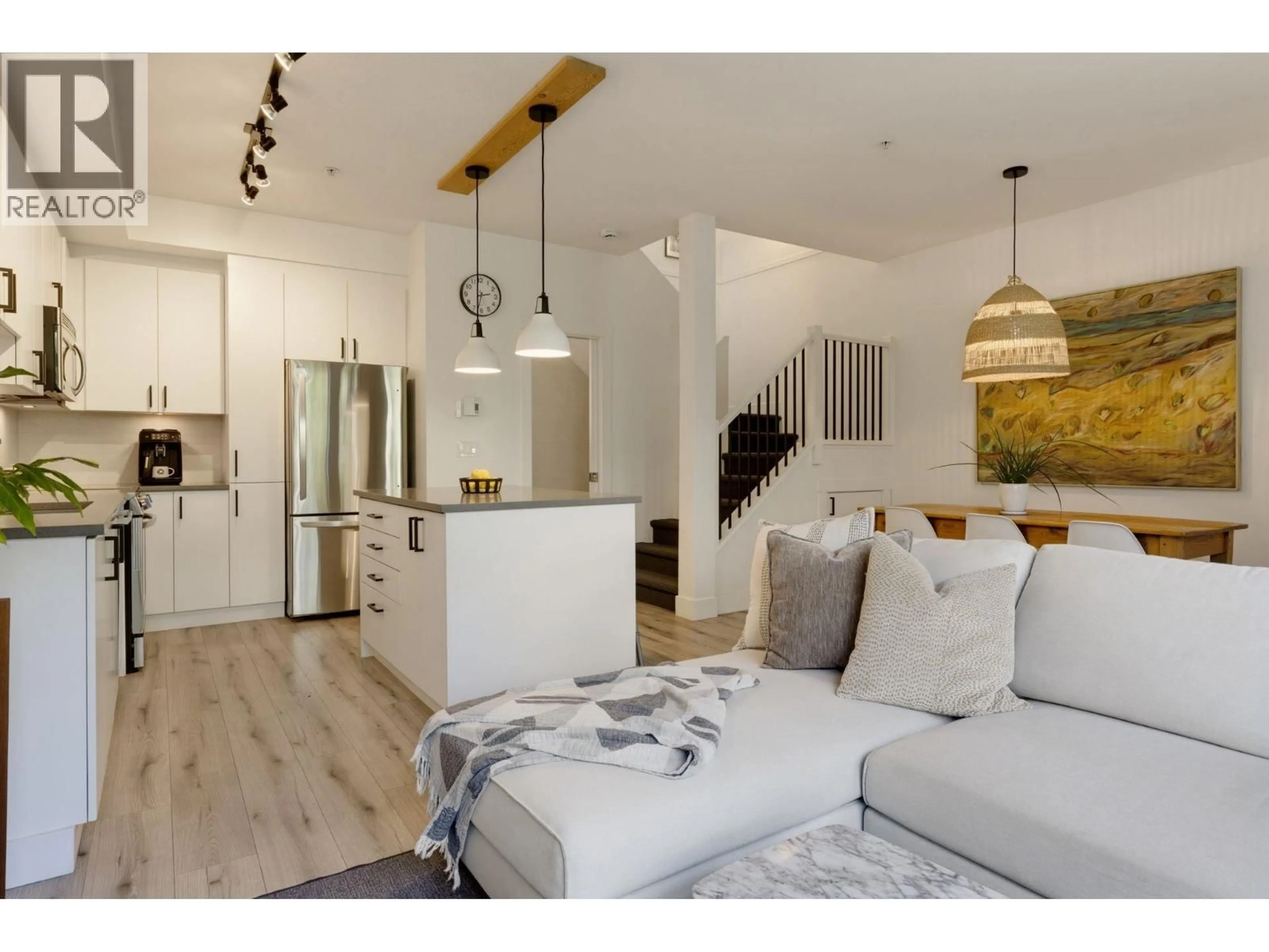 Open concept kitchen, wood/laminate floor for 234 - 735 15TH STREET, North Vancouver British Columbia V7M0B8