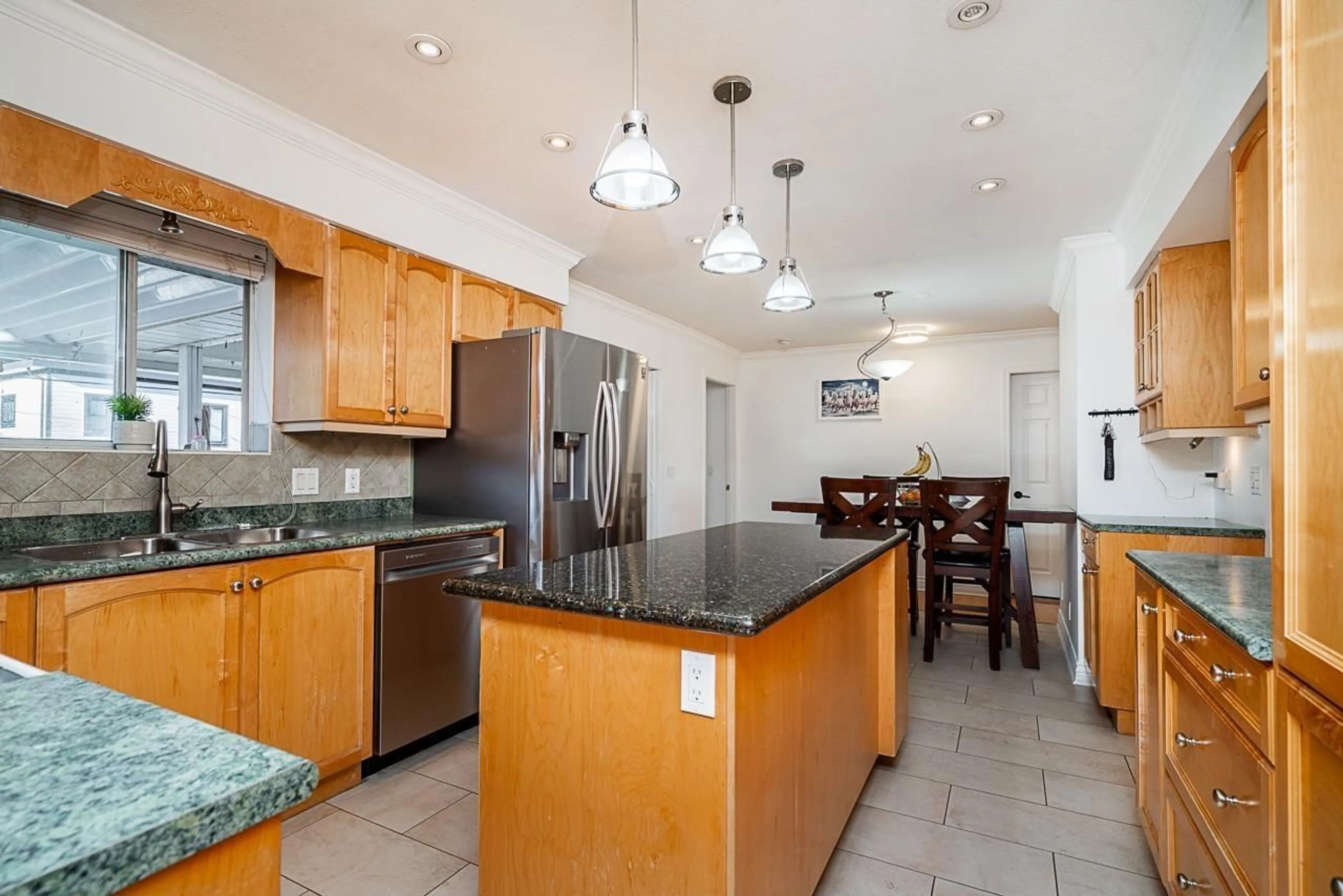 Open concept kitchen, ceramic/tile floor for 14523 89 AVENUE, Surrey British Columbia V3R8B2