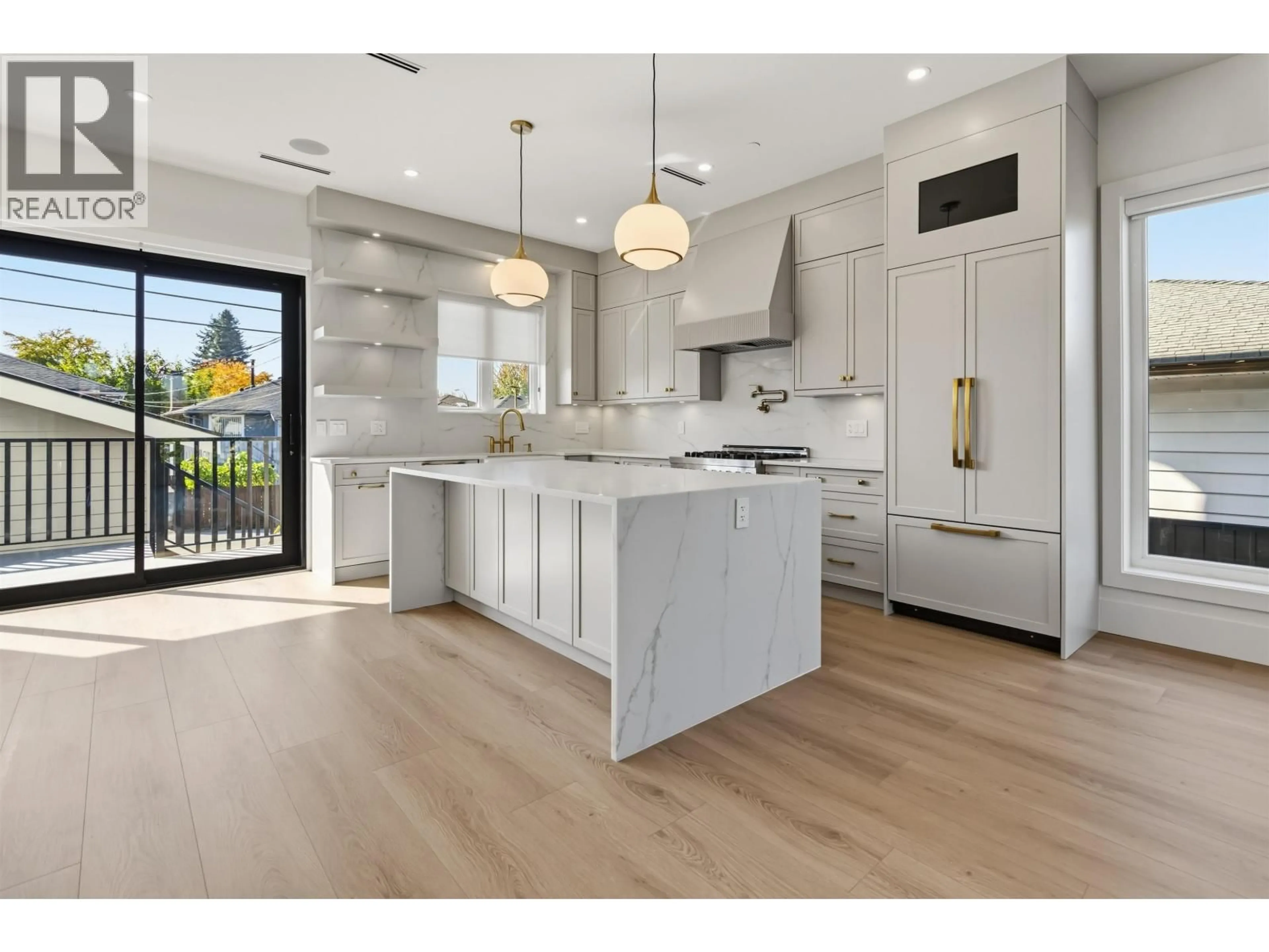Open concept kitchen, wood/laminate floor for 3290 48TH AVENUE, Vancouver British Columbia V5S1H5