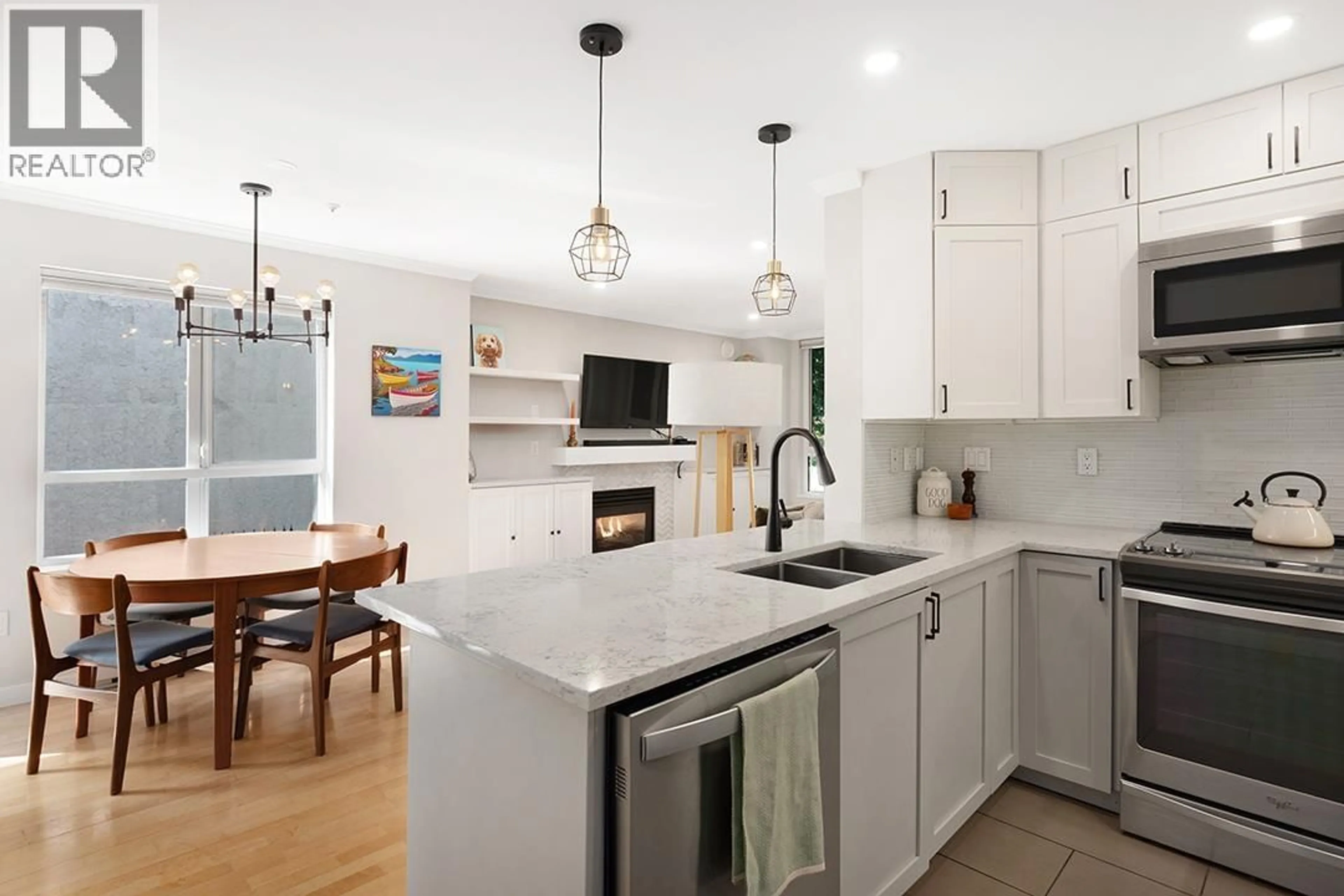 Open concept kitchen, ceramic/tile floor for 203 - 3235 4TH AVENUE, Vancouver British Columbia V6K1R8