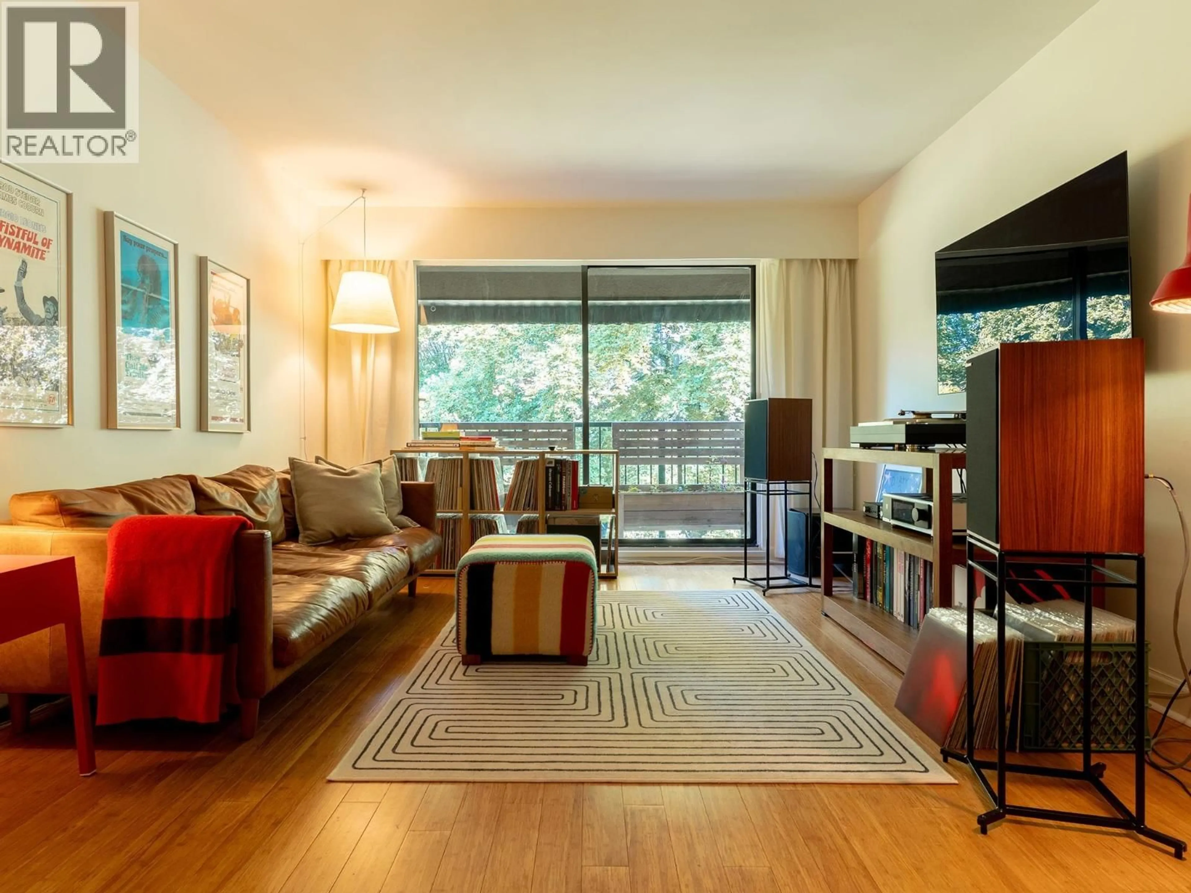 Living room with furniture, wood/laminate floor for 302 - 2222 CAMBRIDGE STREET, Vancouver British Columbia V5L1E6