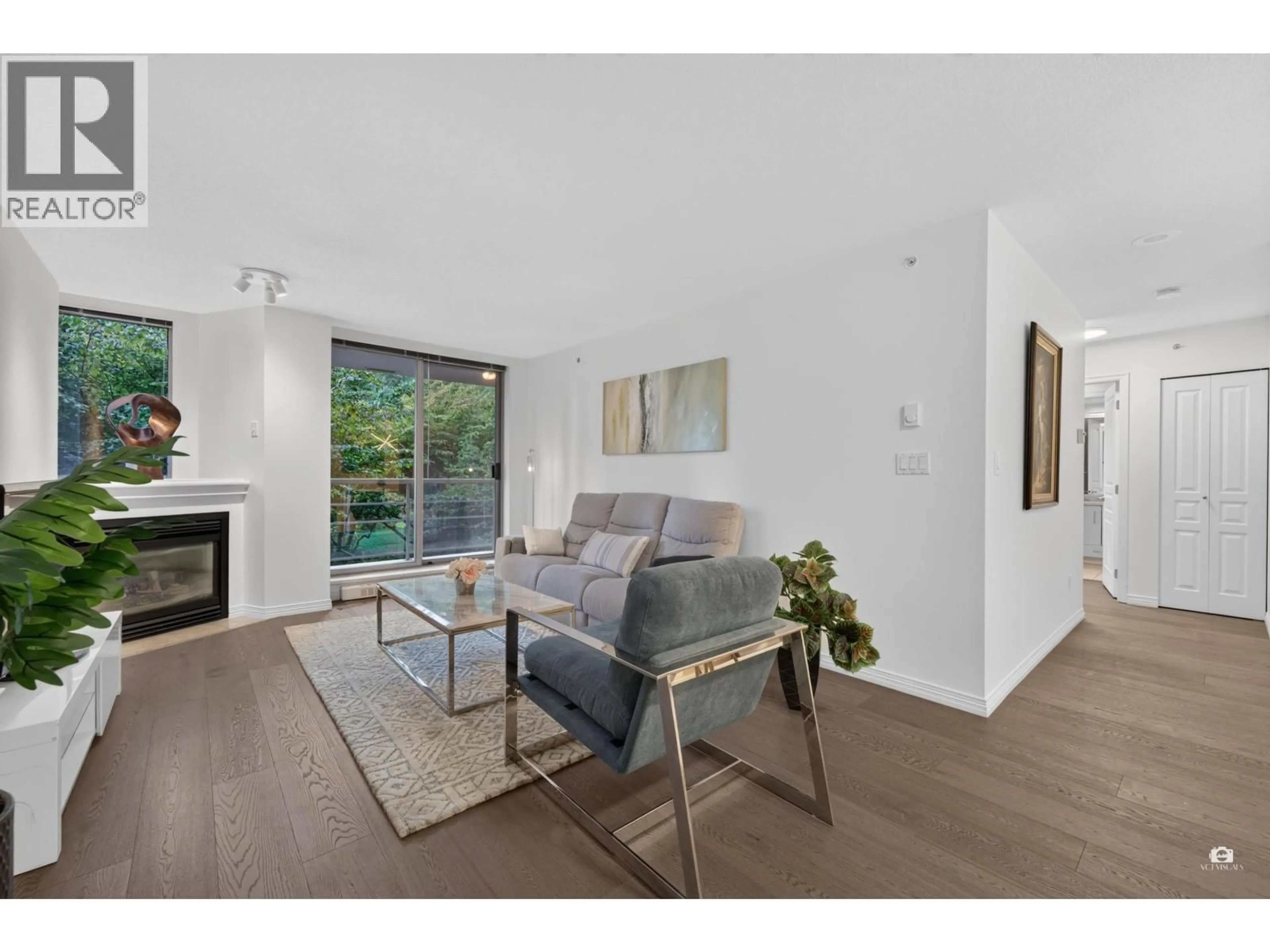 Living room with furniture, wood/laminate floor for 202 - 5639 HAMPTON PLACE, Vancouver British Columbia V6T2H6