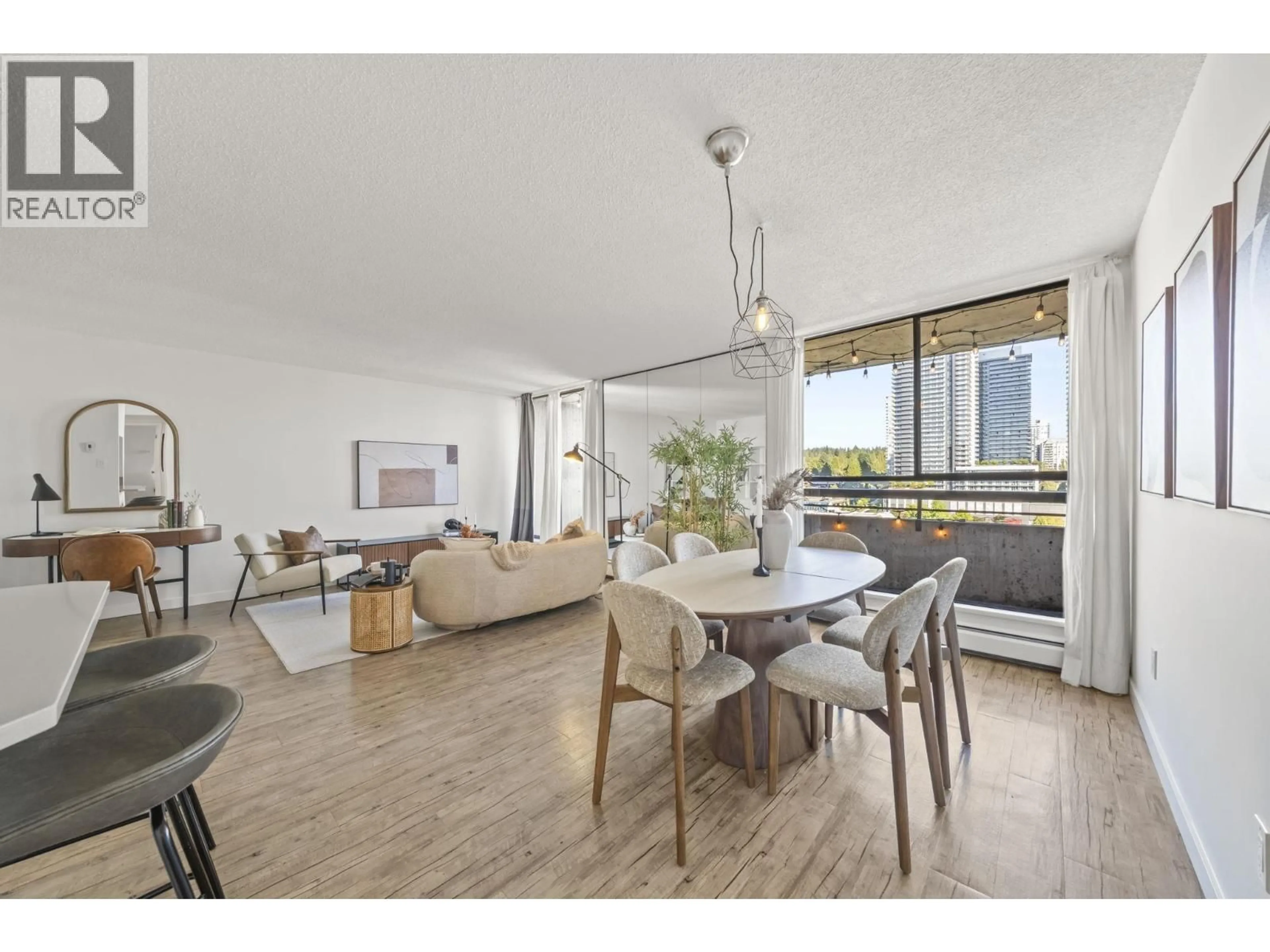 Living room with furniture, wood/laminate floor for 1504 - 3771 BARTLETT COURT, Burnaby British Columbia V3J7G8