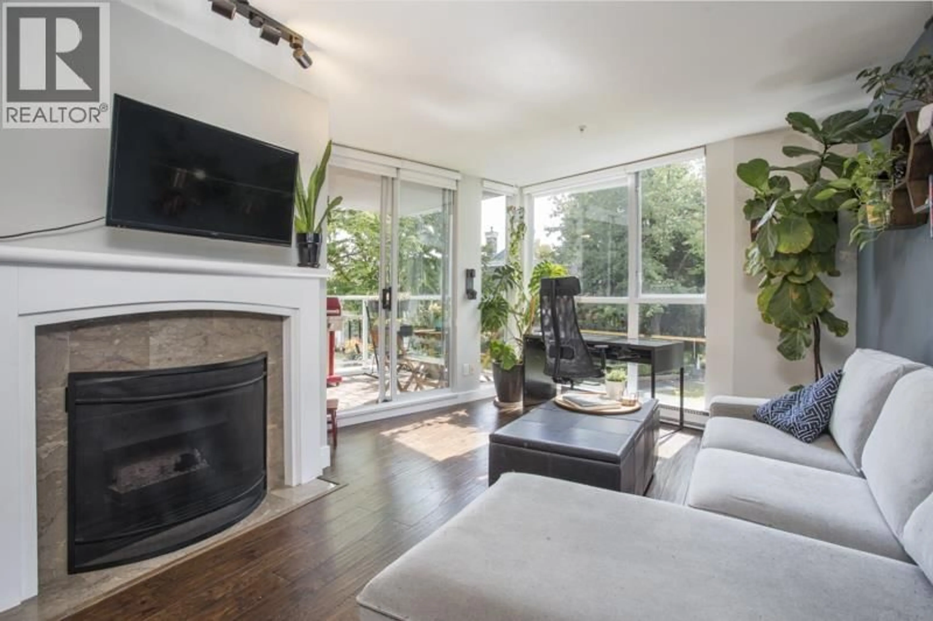 Living room with furniture, unknown for 211 - 8460 JELLICOE STREET, Vancouver British Columbia V5S4S8