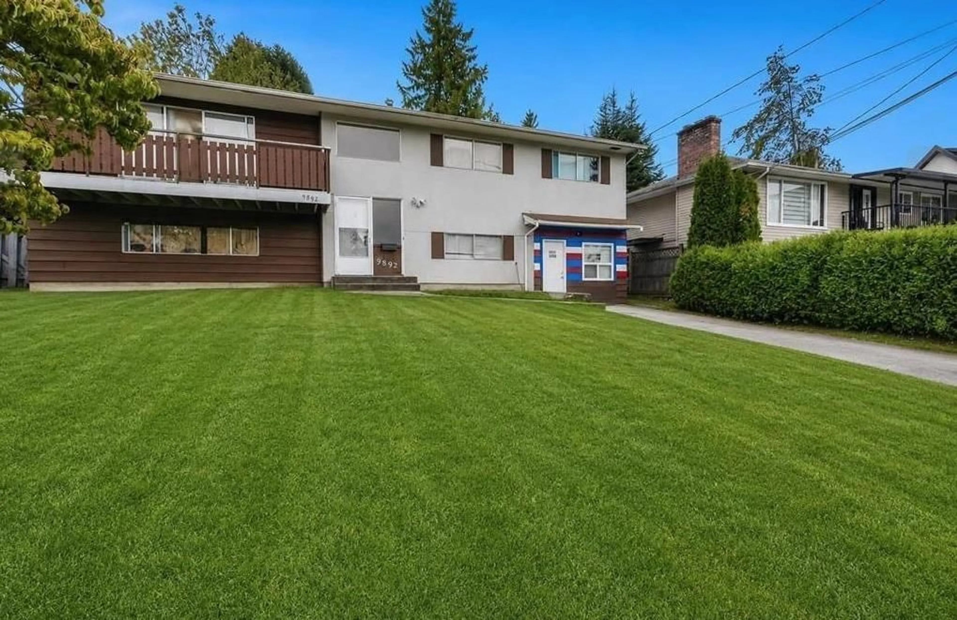 A pic from outside/outdoor area/front of a property/back of a property/a pic from drone, street for 9892 130 STREET, Surrey British Columbia V3T3L4
