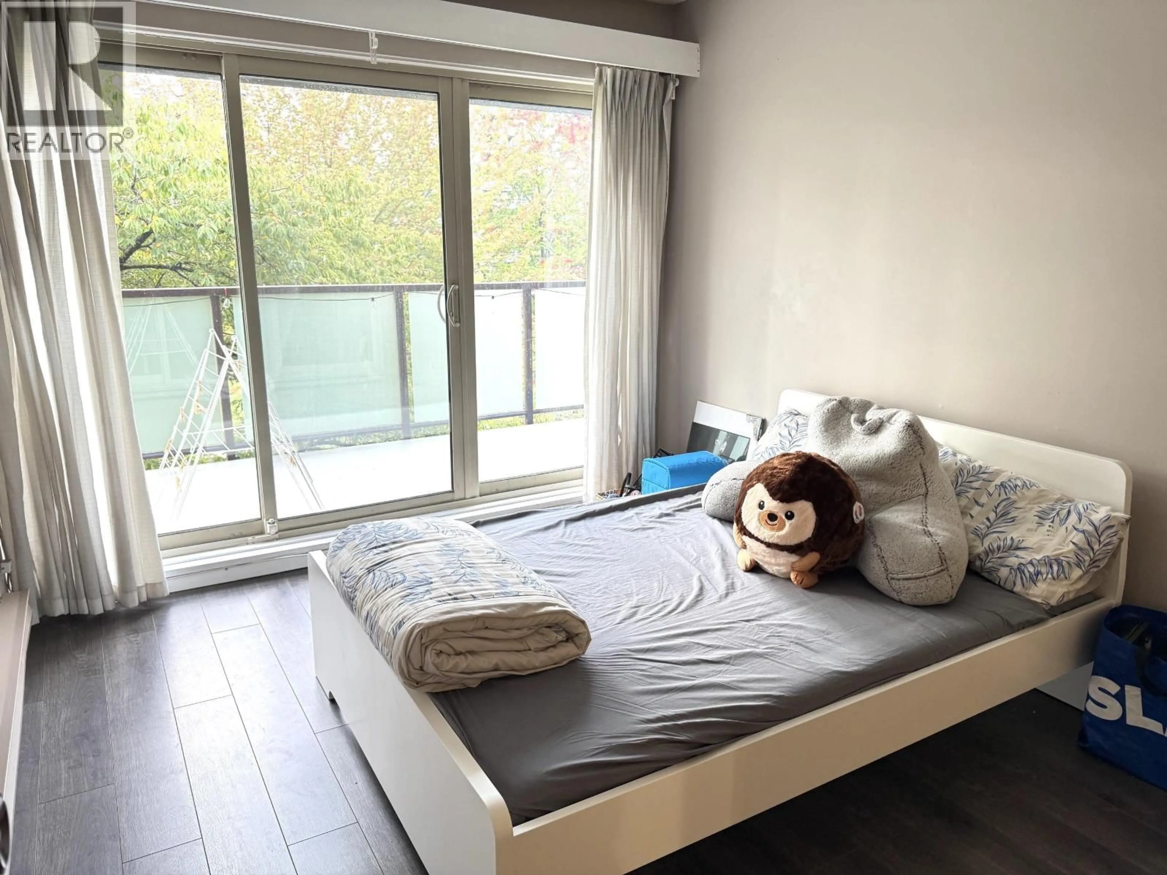 Bedroom with bed, wood/laminate floor for 306 - 4363 HALIFAX STREET, Burnaby British Columbia V5C5Z3