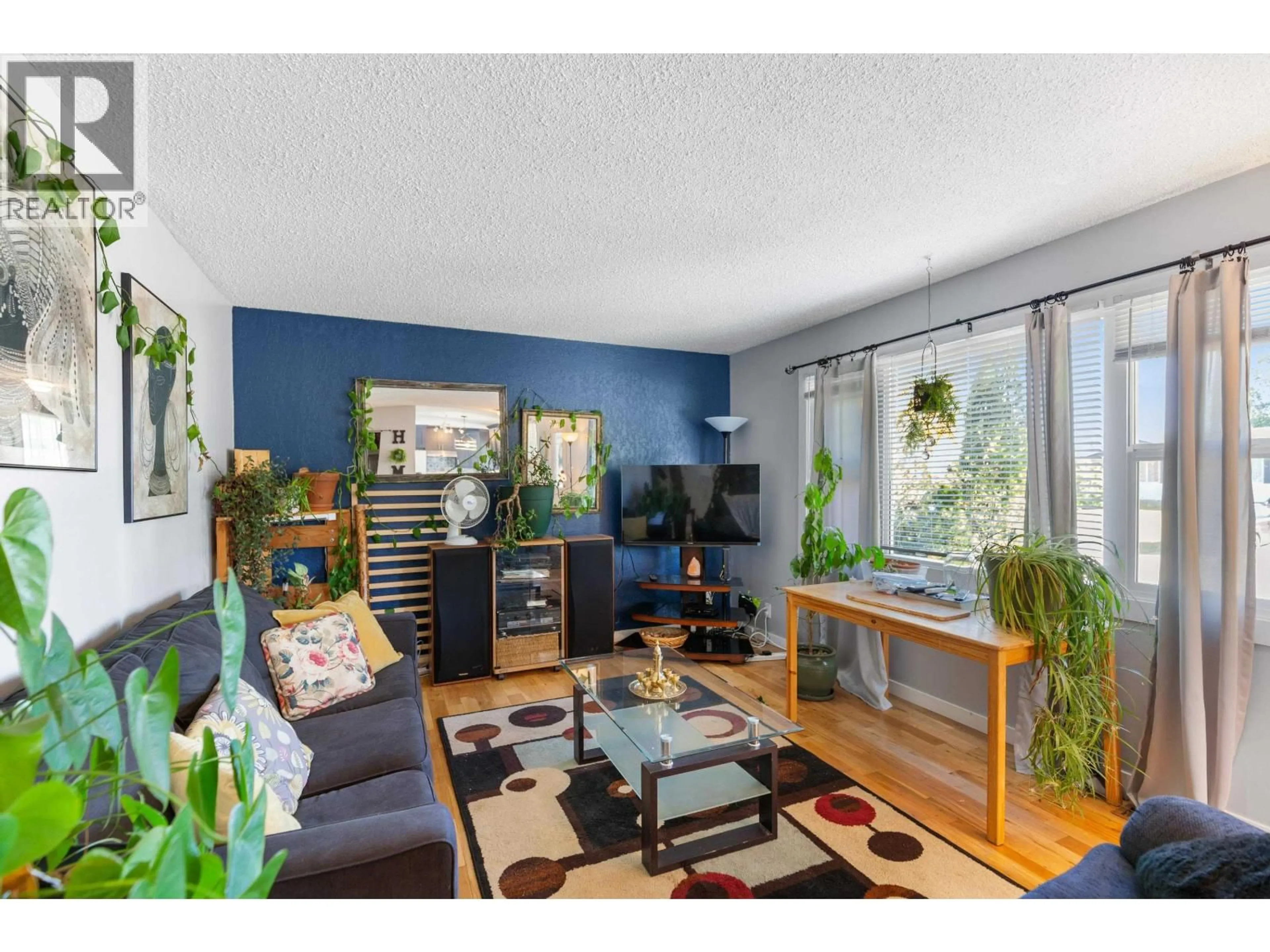 Living room with furniture, wood/laminate floor for 3918 ENEMARK CRESCENT, Prince George British Columbia V2N2X5