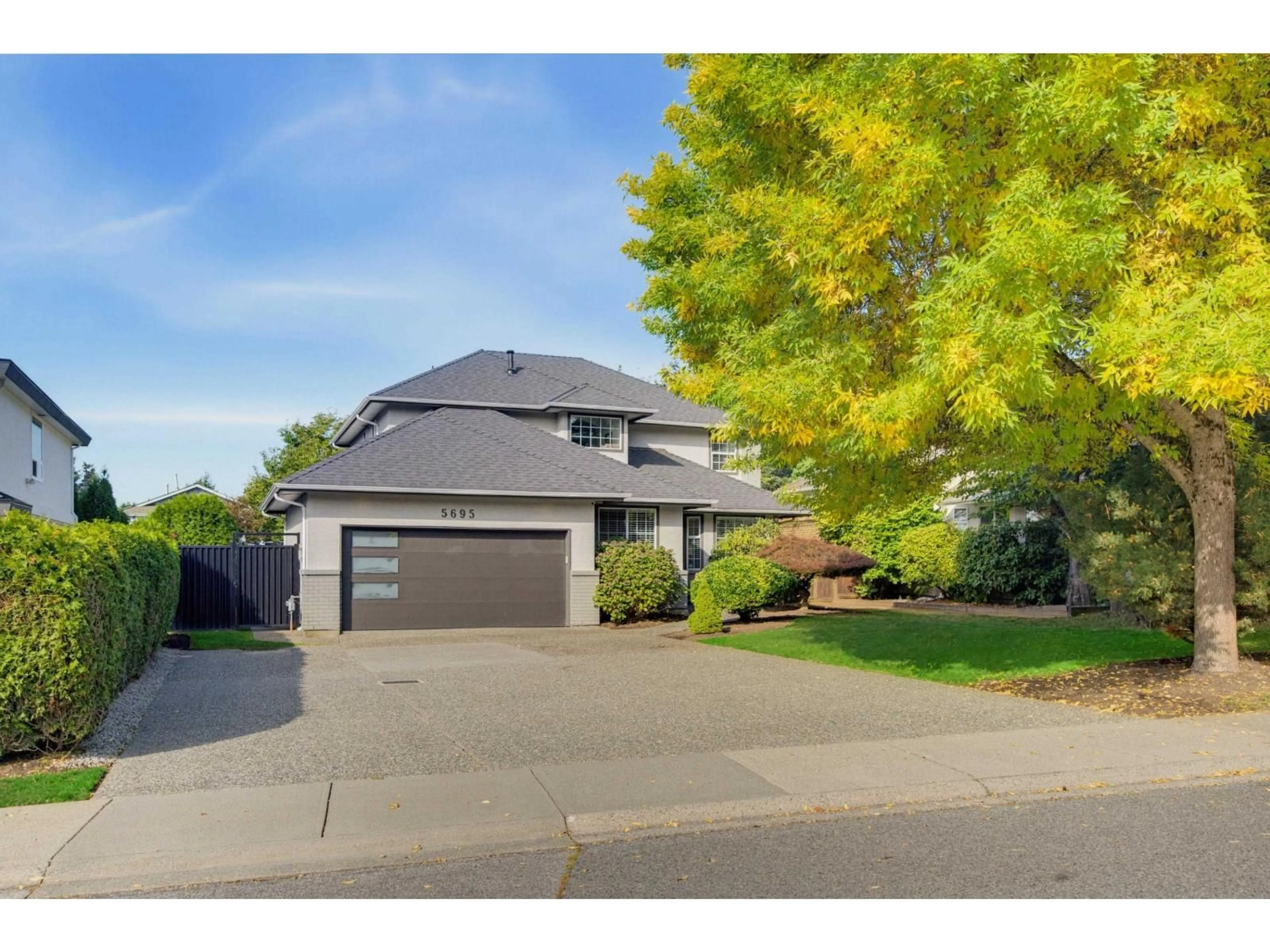 Home with vinyl exterior material, street for 5695 185 STREET, Surrey British Columbia V3S7T1