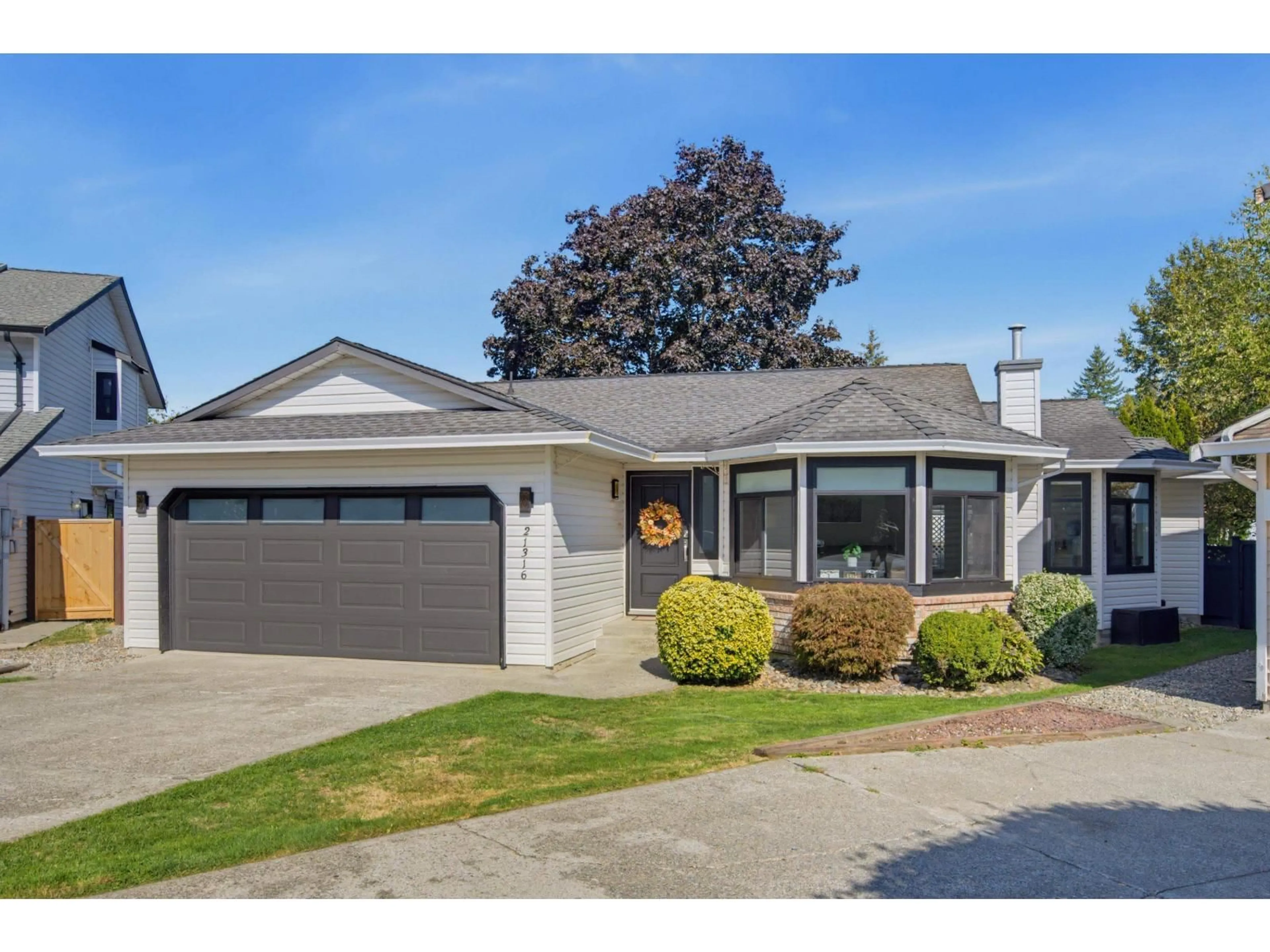 Home with vinyl exterior material, street for 21316 89A AVENUE, Langley British Columbia V1M1Z5