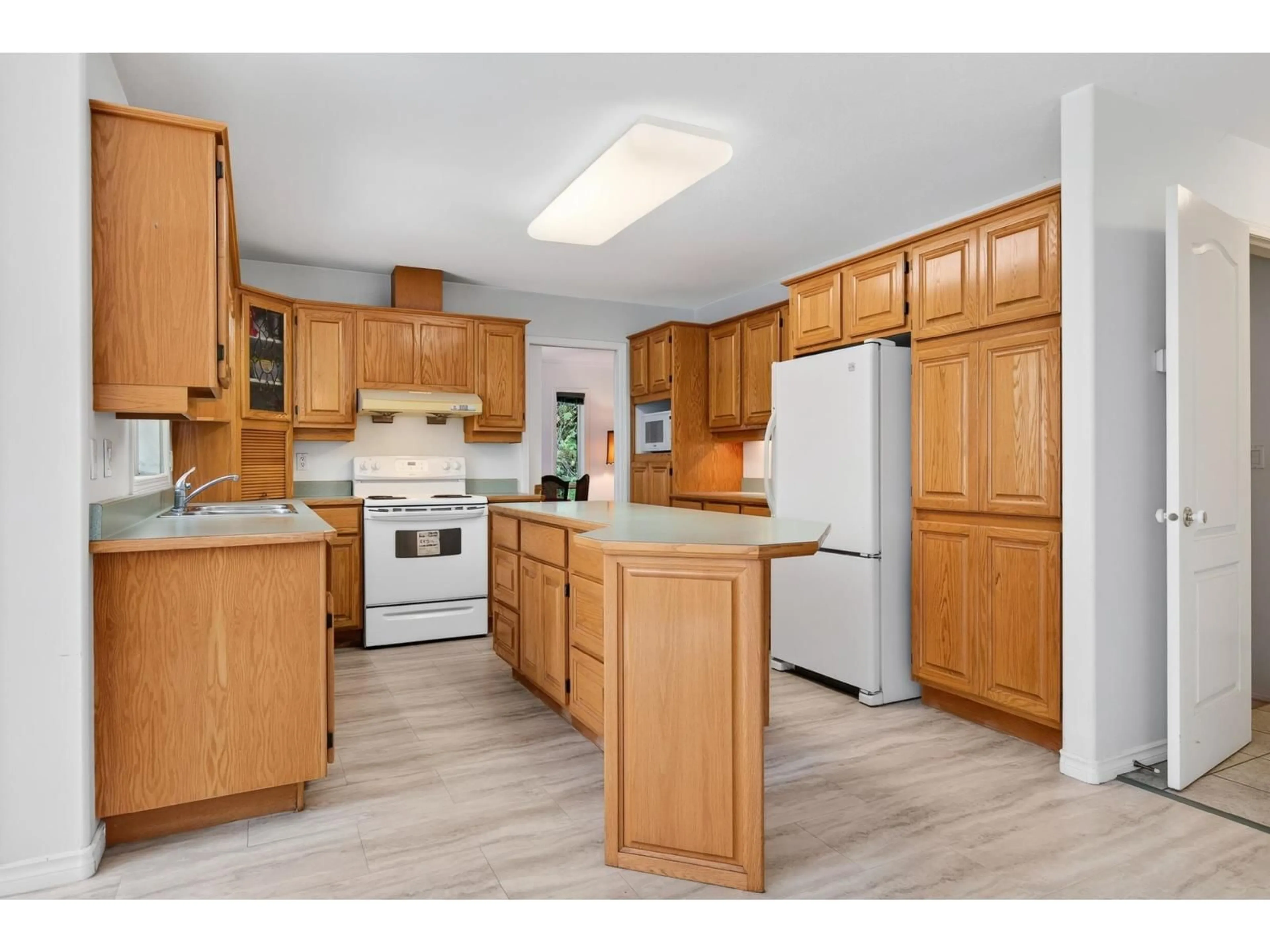 Standard kitchen, wood/laminate floor for 8630 SUNBURST PLACE, Chilliwack British Columbia V2R3J1