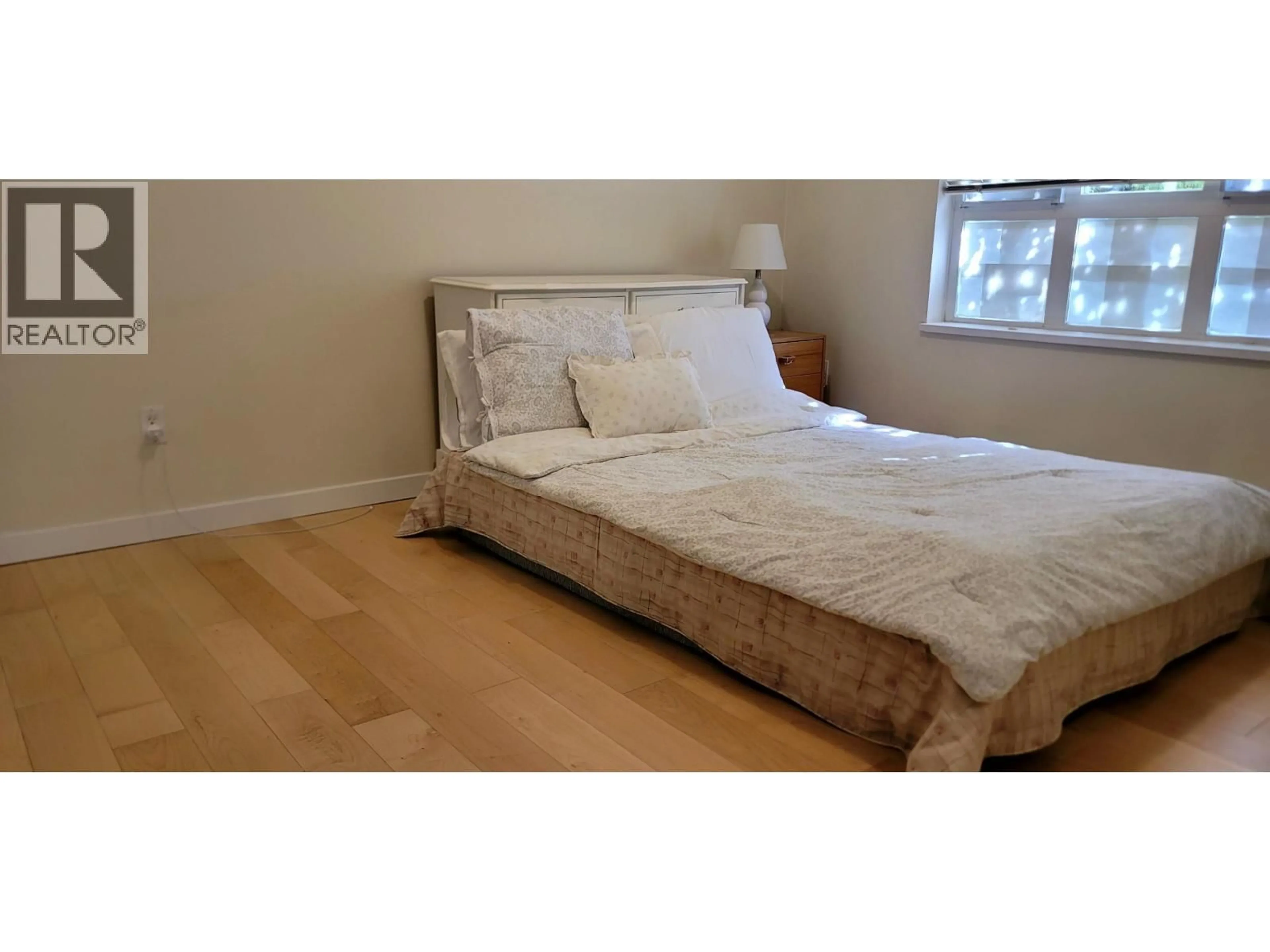 Bedroom with bed, wood/laminate floor for 3238 54TH AVENUE, Vancouver British Columbia V5S4W7