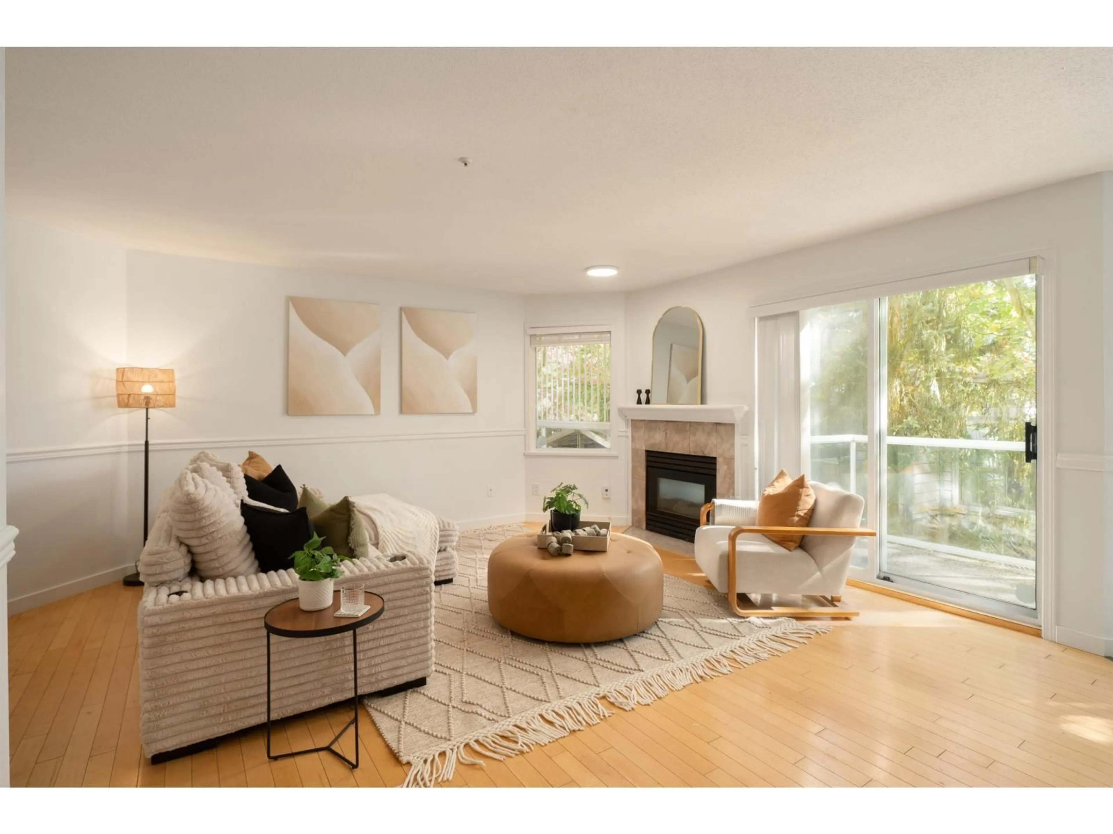 Living room with furniture, wood/laminate floor for 105 - 20240 54A AVENUE, Langley British Columbia V3A3W7