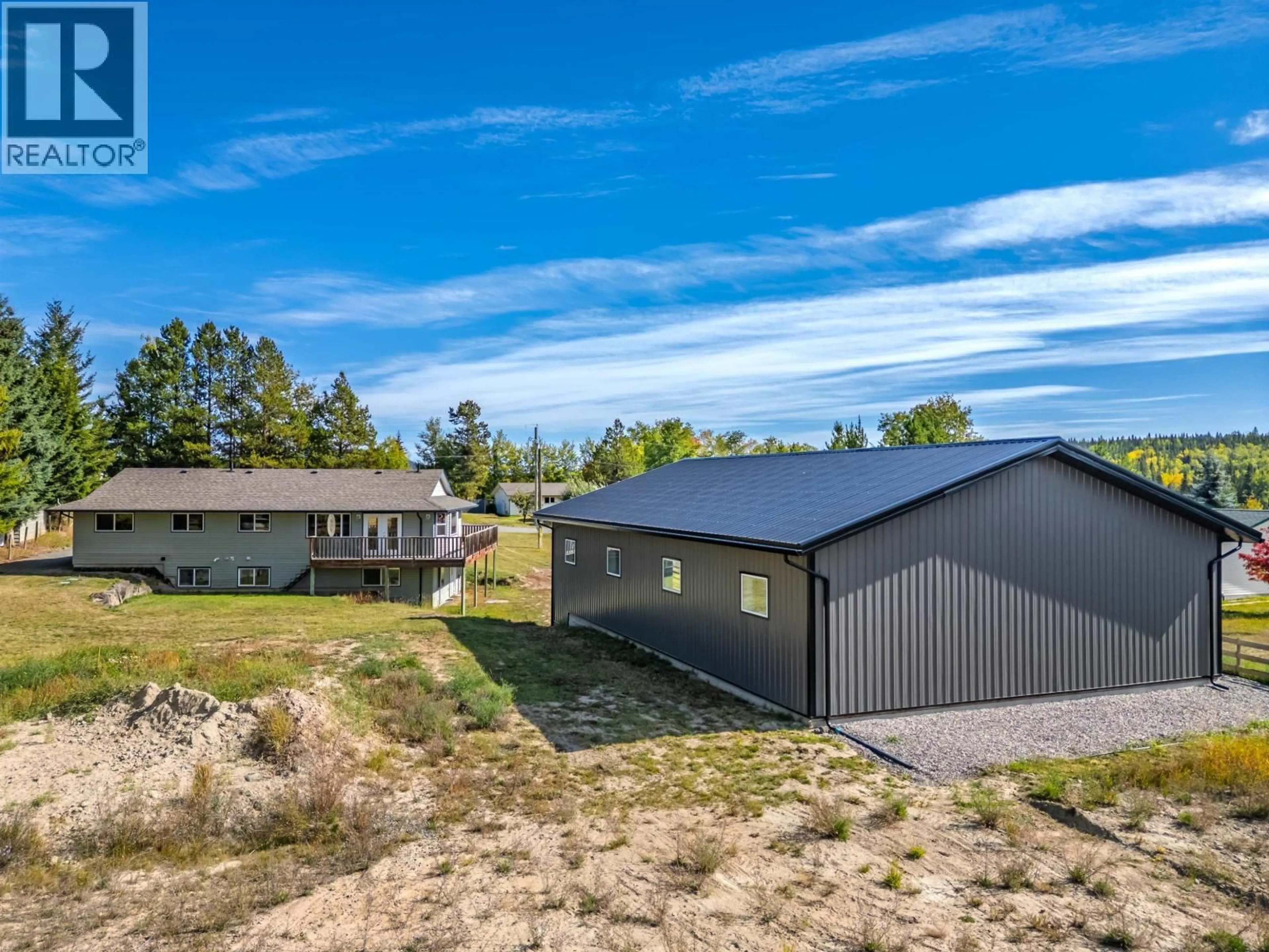 A pic from outside/outdoor area/front of a property/back of a property/a pic from drone, mountain view for 6500 GREY CRESCENT, 100 Mile House British Columbia V0K2E3