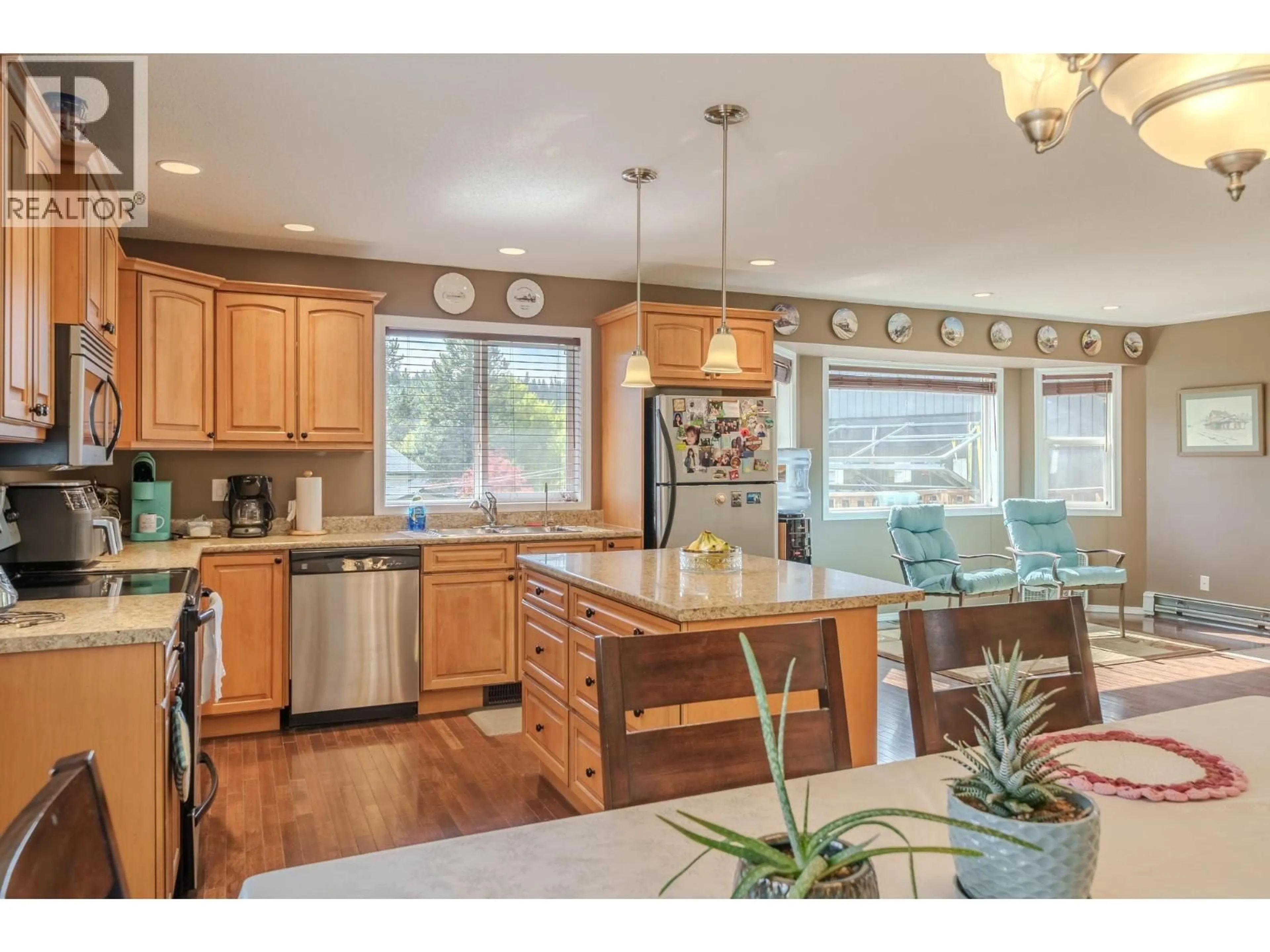 Open concept kitchen, wood/laminate floor for 6500 GREY CRESCENT, 100 Mile House British Columbia V0K2E3