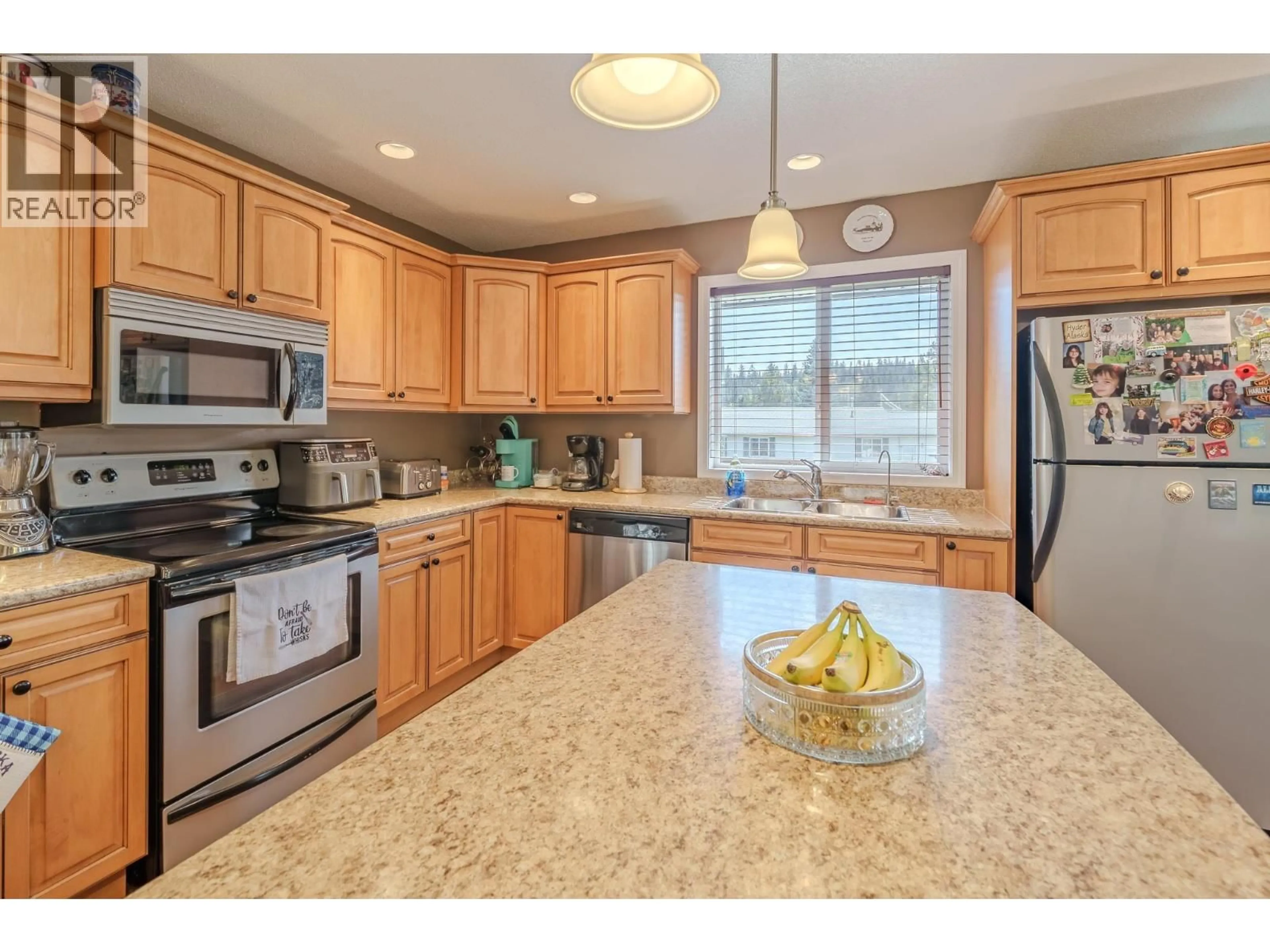 Open concept kitchen, ceramic/tile floor for 6500 GREY CRESCENT, 100 Mile House British Columbia V0K2E3