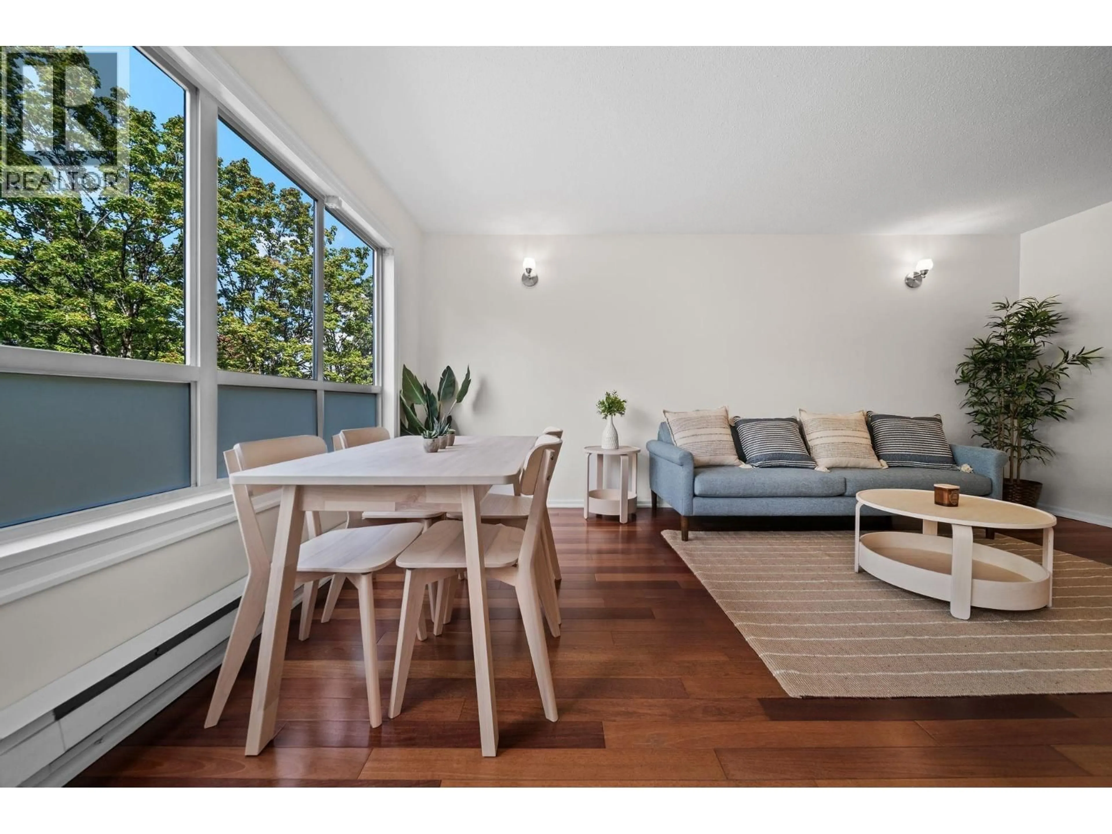 Living room with furniture, wood/laminate floor for 201 - 4990 MCGEER STREET, Vancouver British Columbia V5R6C1